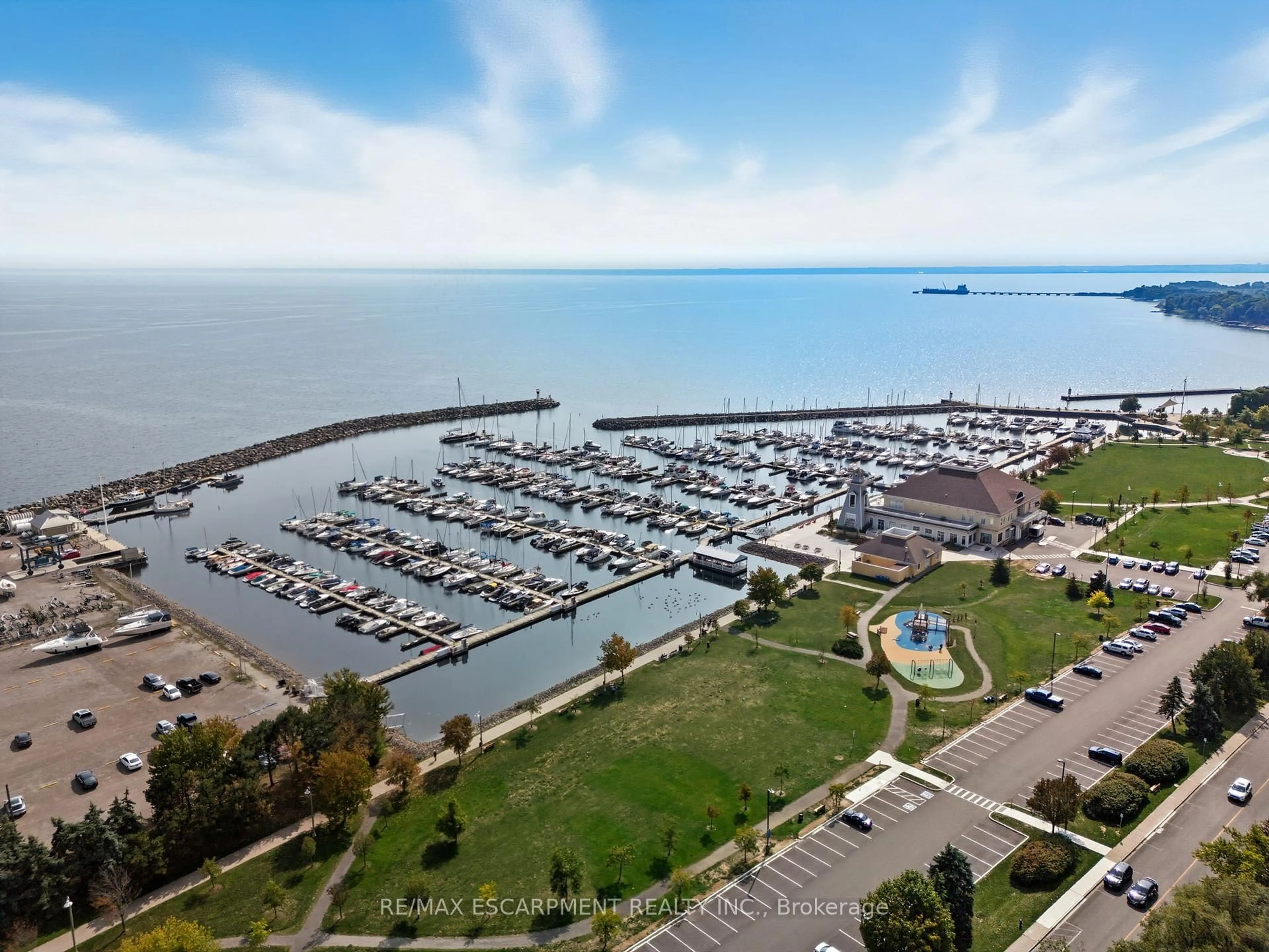A pic from outside/outdoor area/front of a property/back of a property/a pic from drone, water/lake/river/ocean view for 2263 Marine Dr #305, Oakville Ontario L6L 5K1