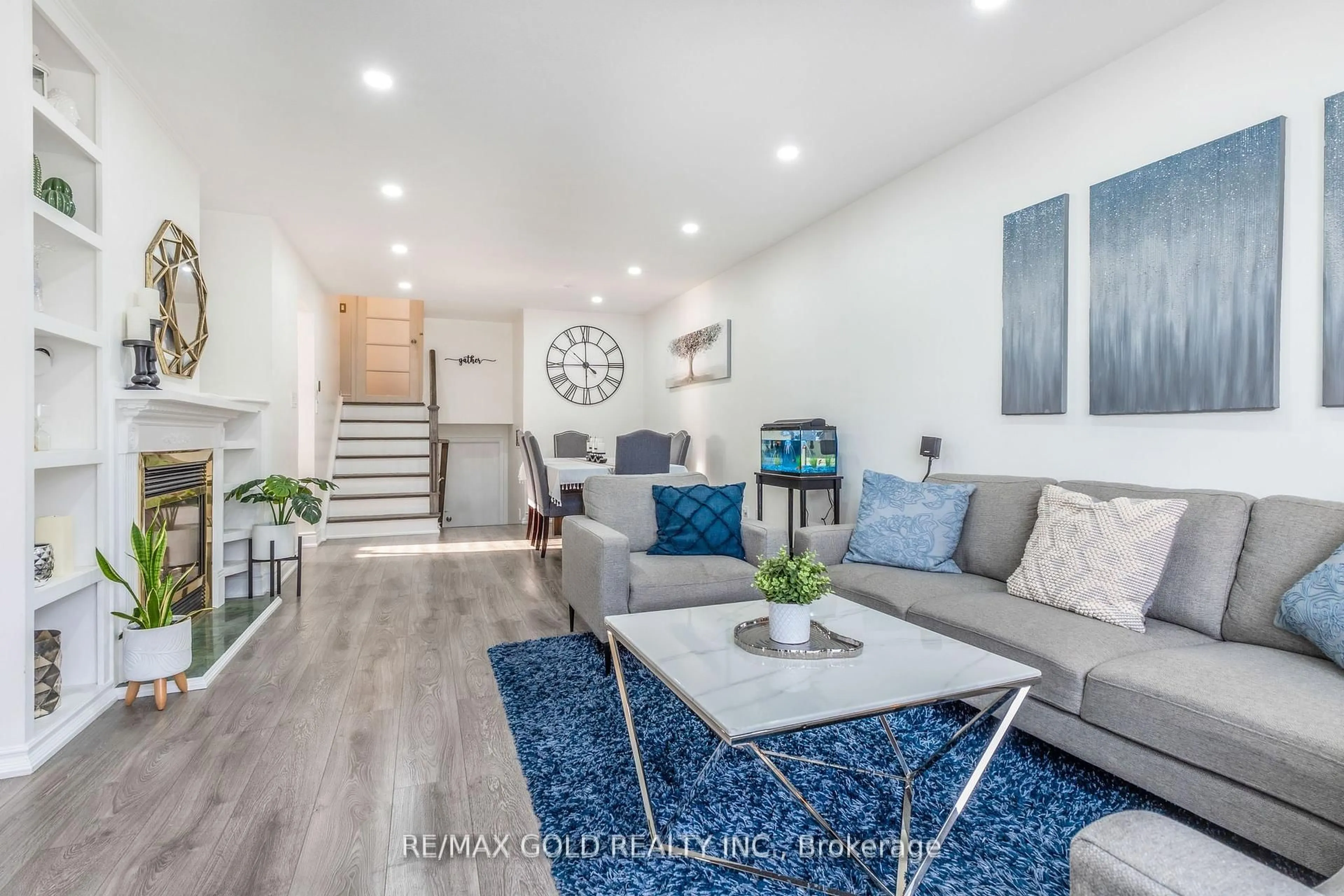 Living room with furniture, wood/laminate floor for 36 Garfield Cres, Brampton Ontario L6V 1V8