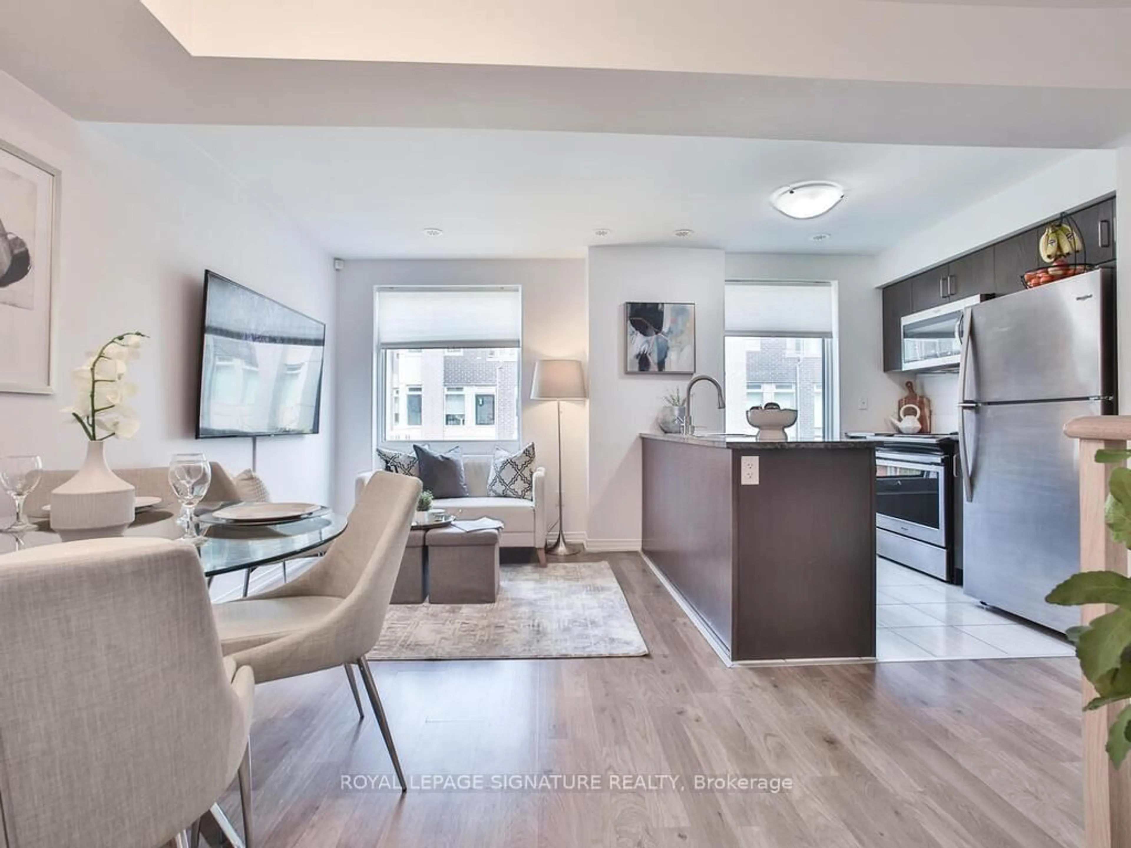 Living room with furniture, unknown for 7 Applewood Lane #232, Toronto Ontario M9C 2Z7
