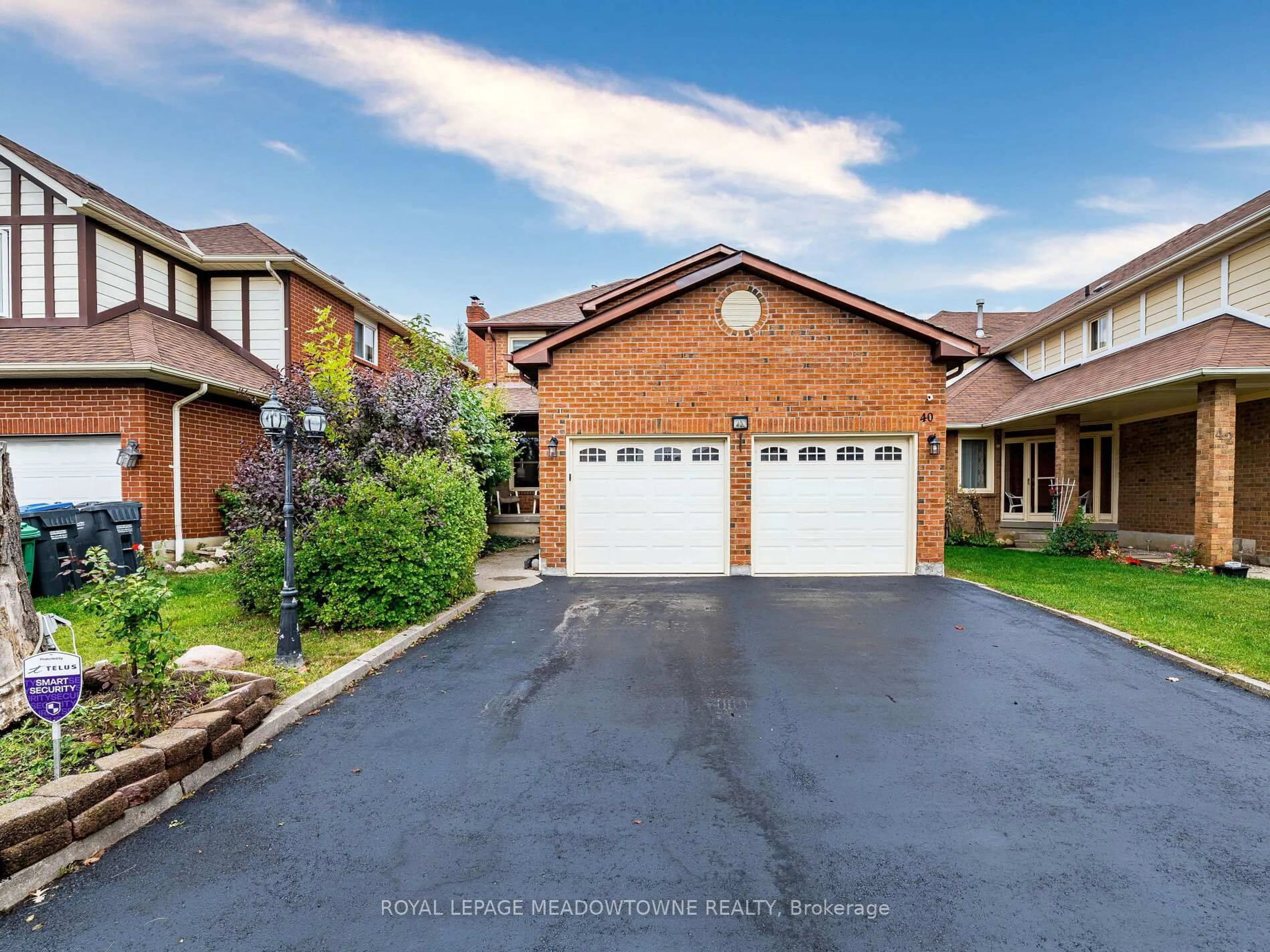 Home with brick exterior material, street for 40 Lord Simcoe Dr, Brampton Ontario L6S 5H3