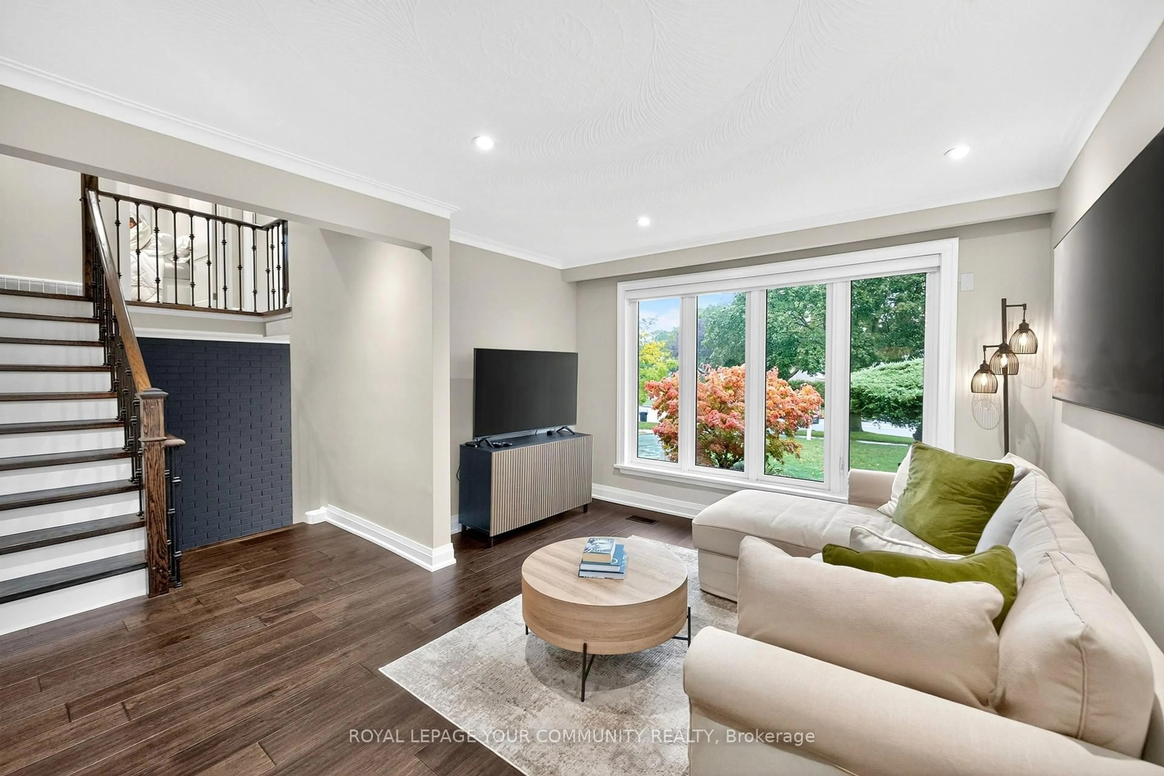 Living room with furniture, wood/laminate floor for 267 Jeffcoat Dr, Toronto Ontario M9W 3E4