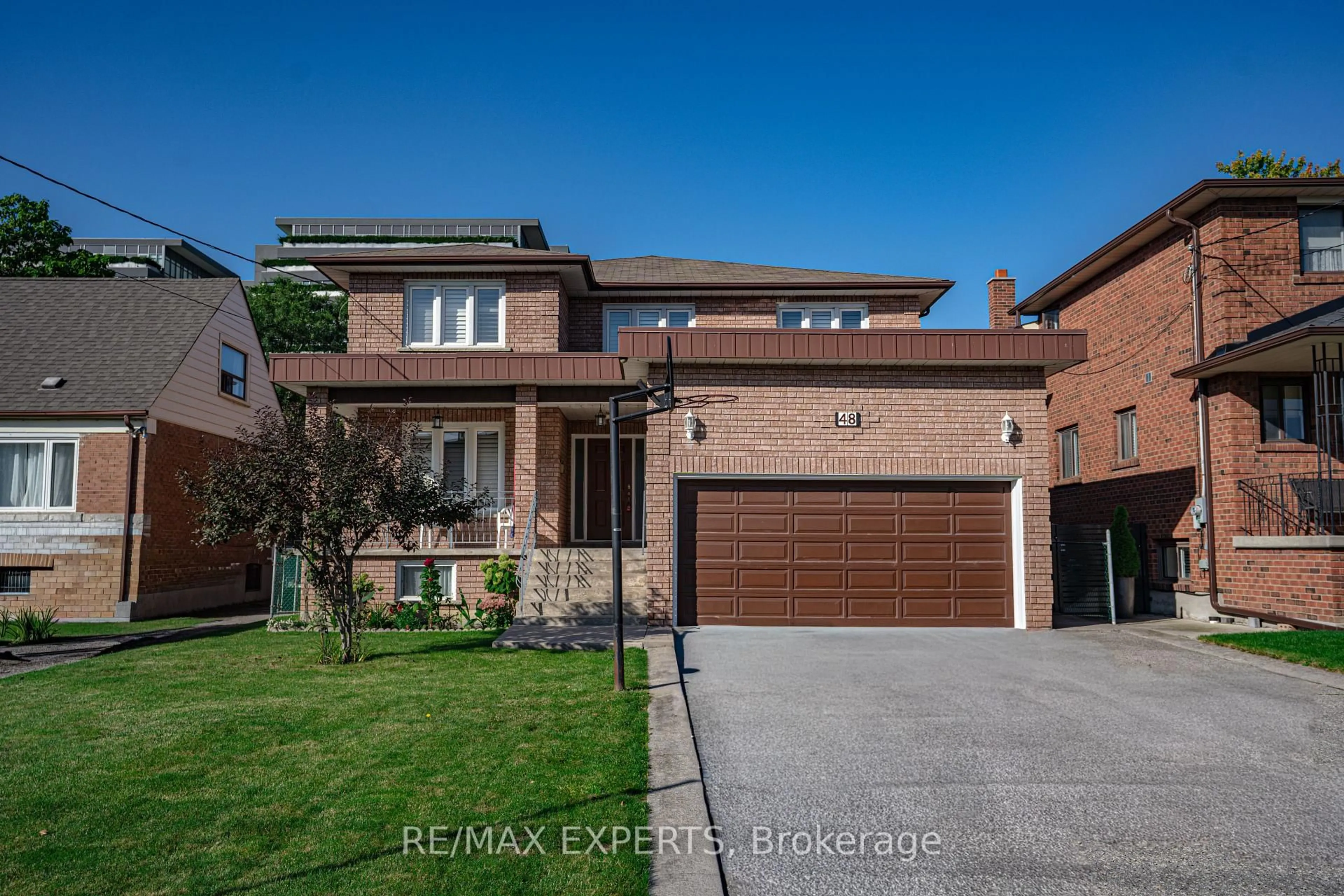 Home with brick exterior material, street for 48 Ingleside Dr, Toronto Ontario M3K 1V1