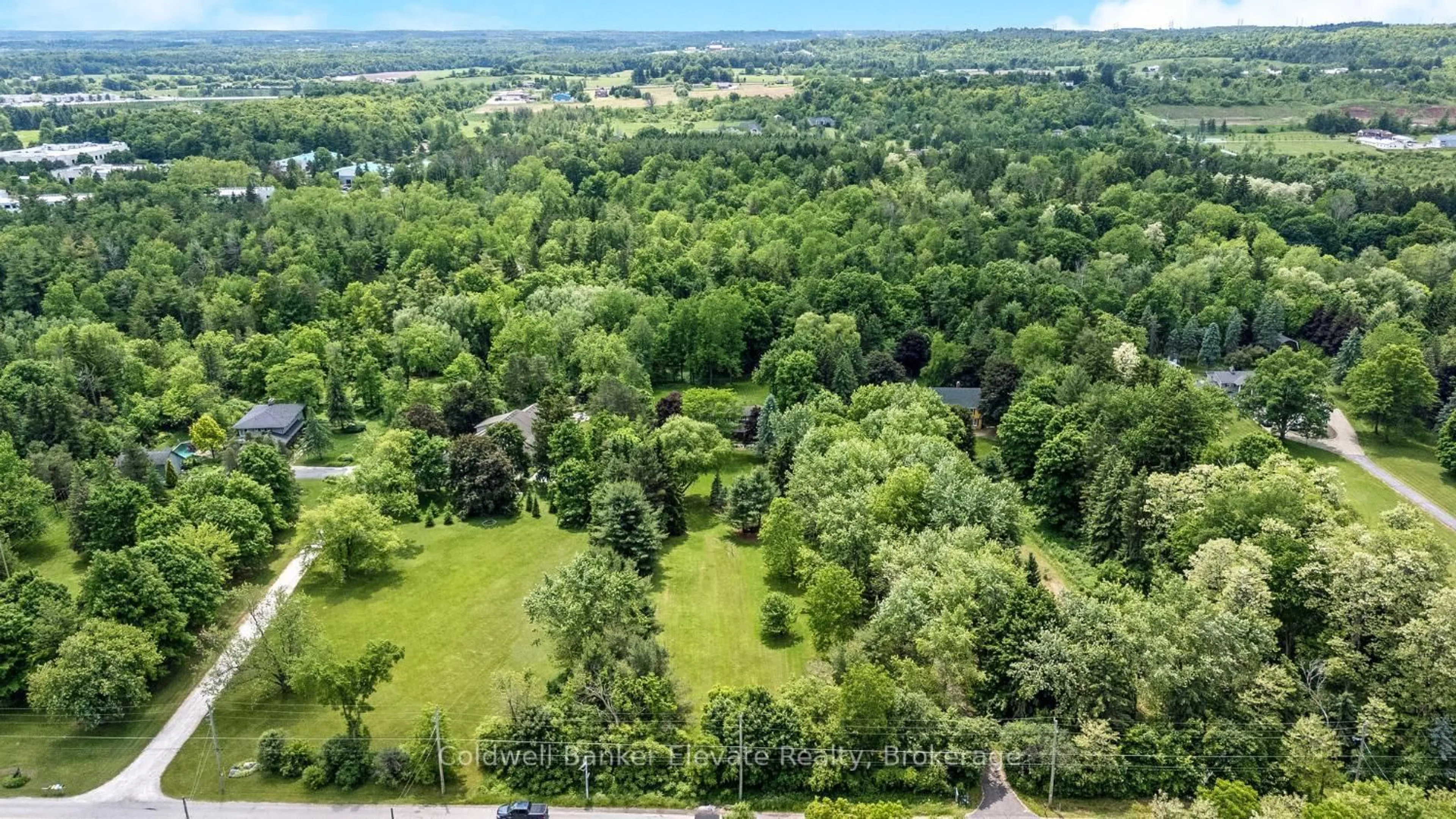A pic from outside/outdoor area/front of a property/back of a property/a pic from drone, forest/trees view for 12282 Eighth Line, Halton Hills Ontario L7G 4S4