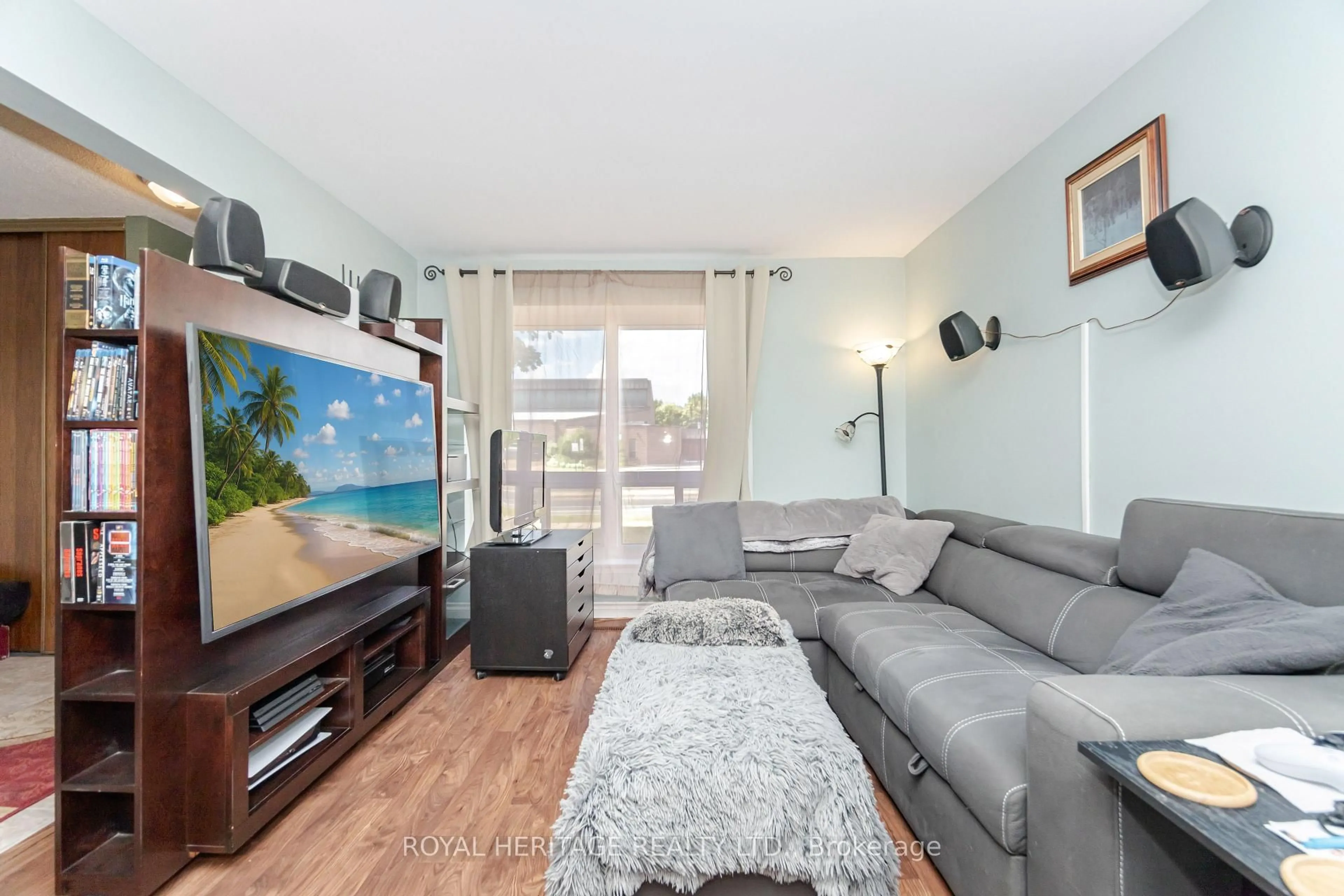 Living room with furniture, wood/laminate floor for 107 Guildford Cres, Brampton Ontario L6S 3K2