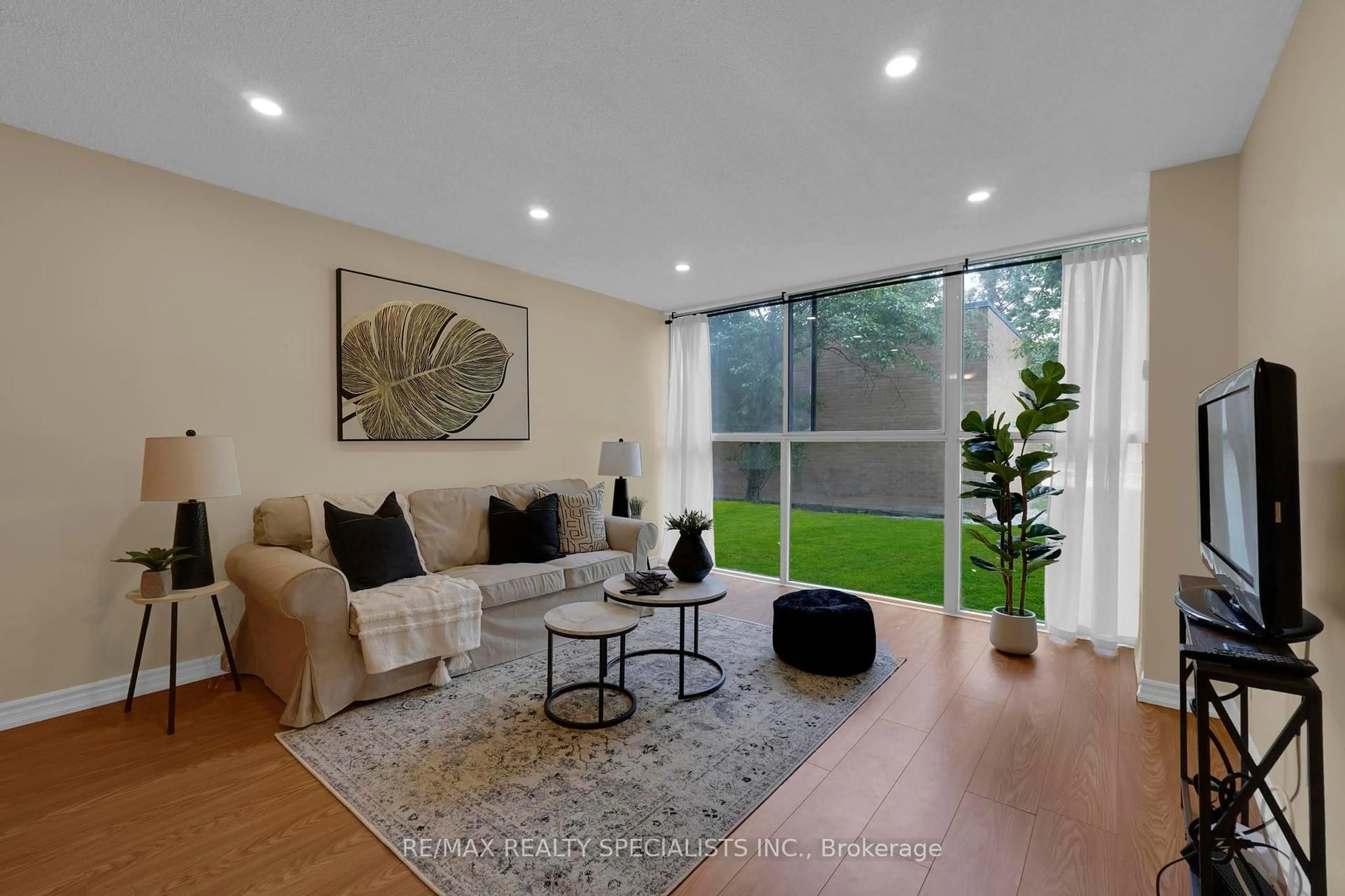 Living room with furniture, unknown for 35 Trailwood Dr #113, Mississauga Ontario L4Z 3L6
