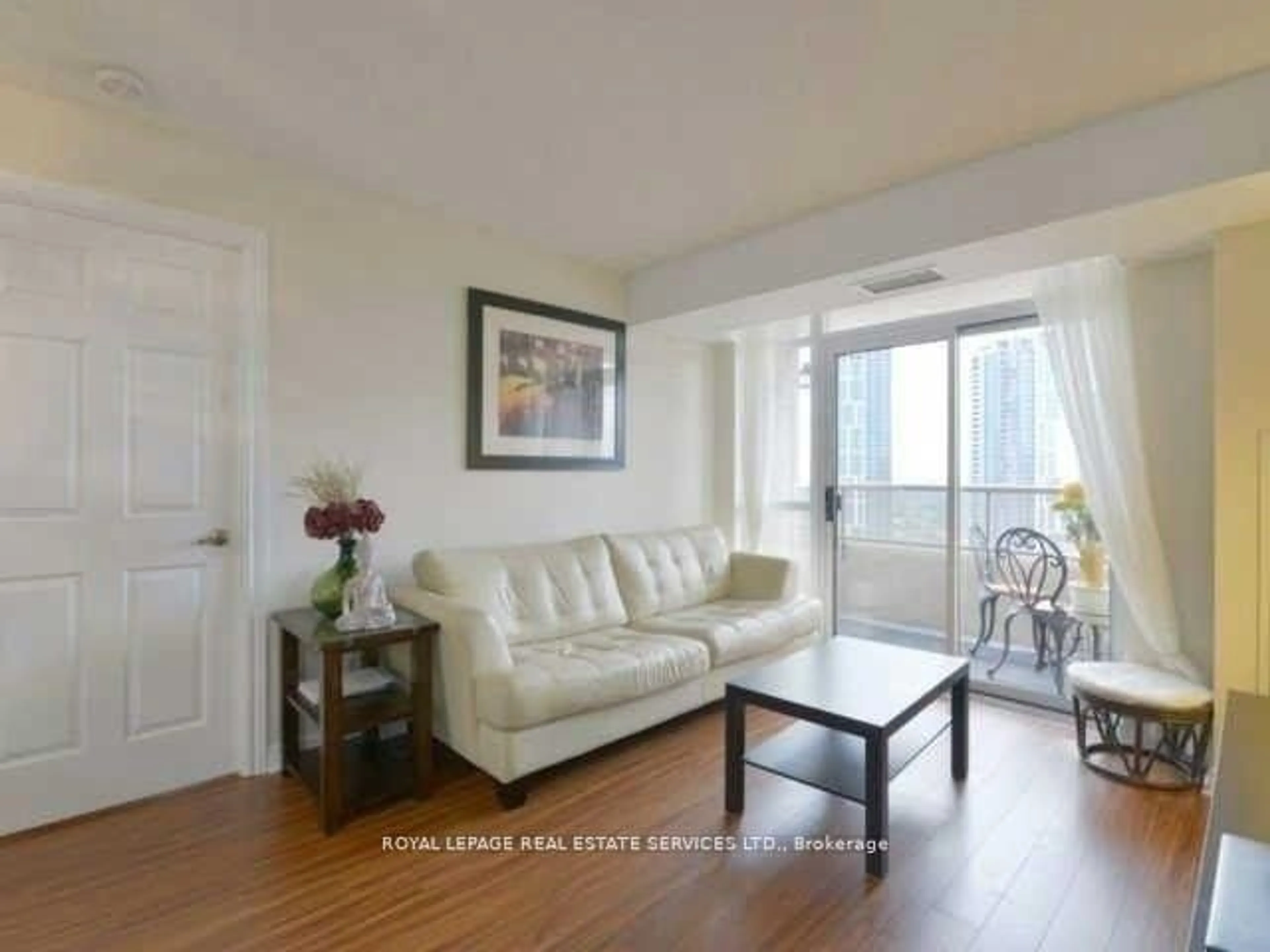 Living room with furniture, wood/laminate floor for 310 Burnhamthorpe Rd #3001, Mississauga Ontario L5B 4P9