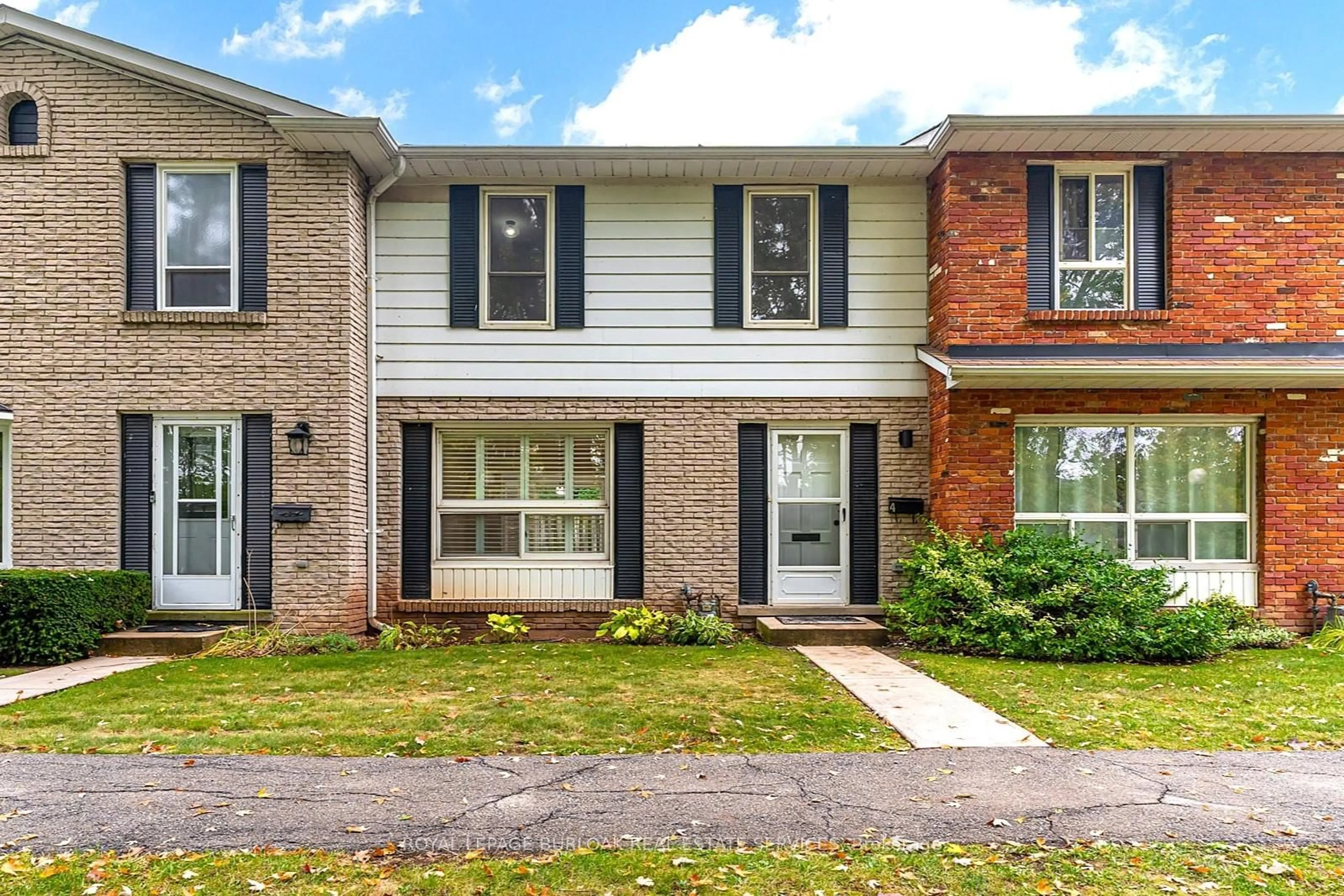 Home with brick exterior material, street for 5475 Lakeshore Rd #4, Burlington Ontario L7L 1E1