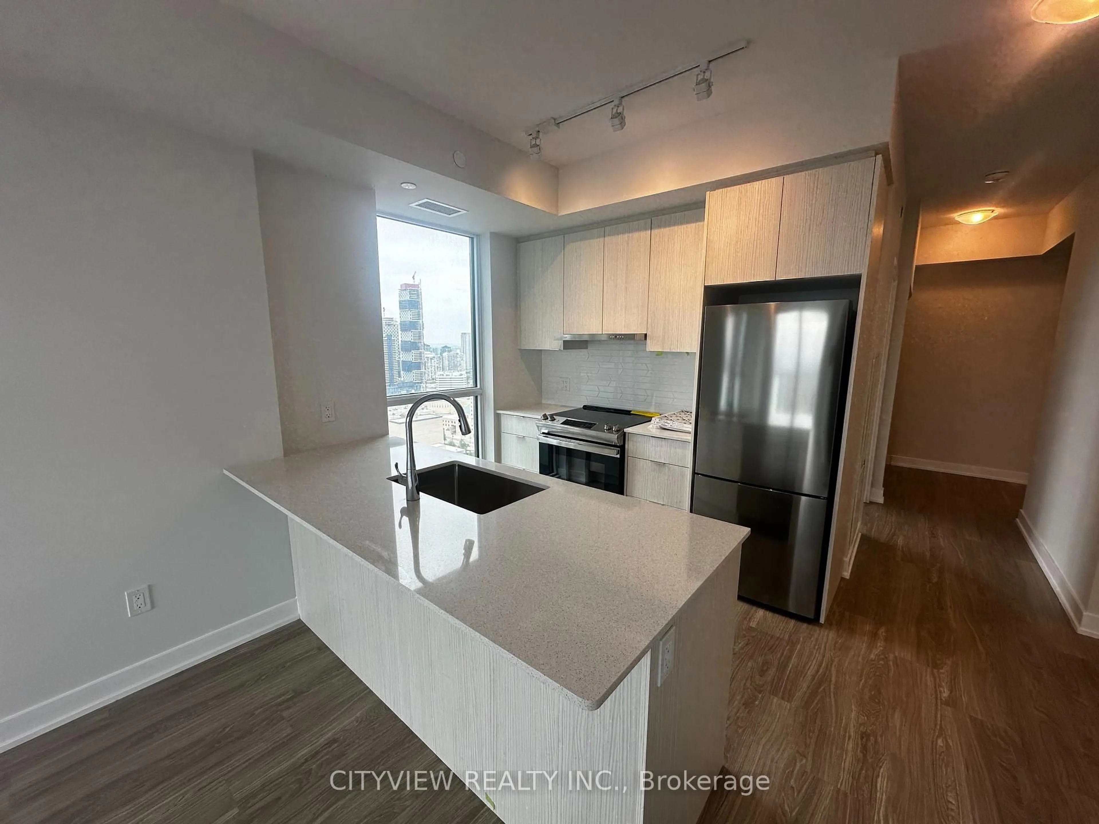 Open concept kitchen, wood/laminate floor for 430 Square One Dr #2911, Mississauga Ontario L5B 0L6