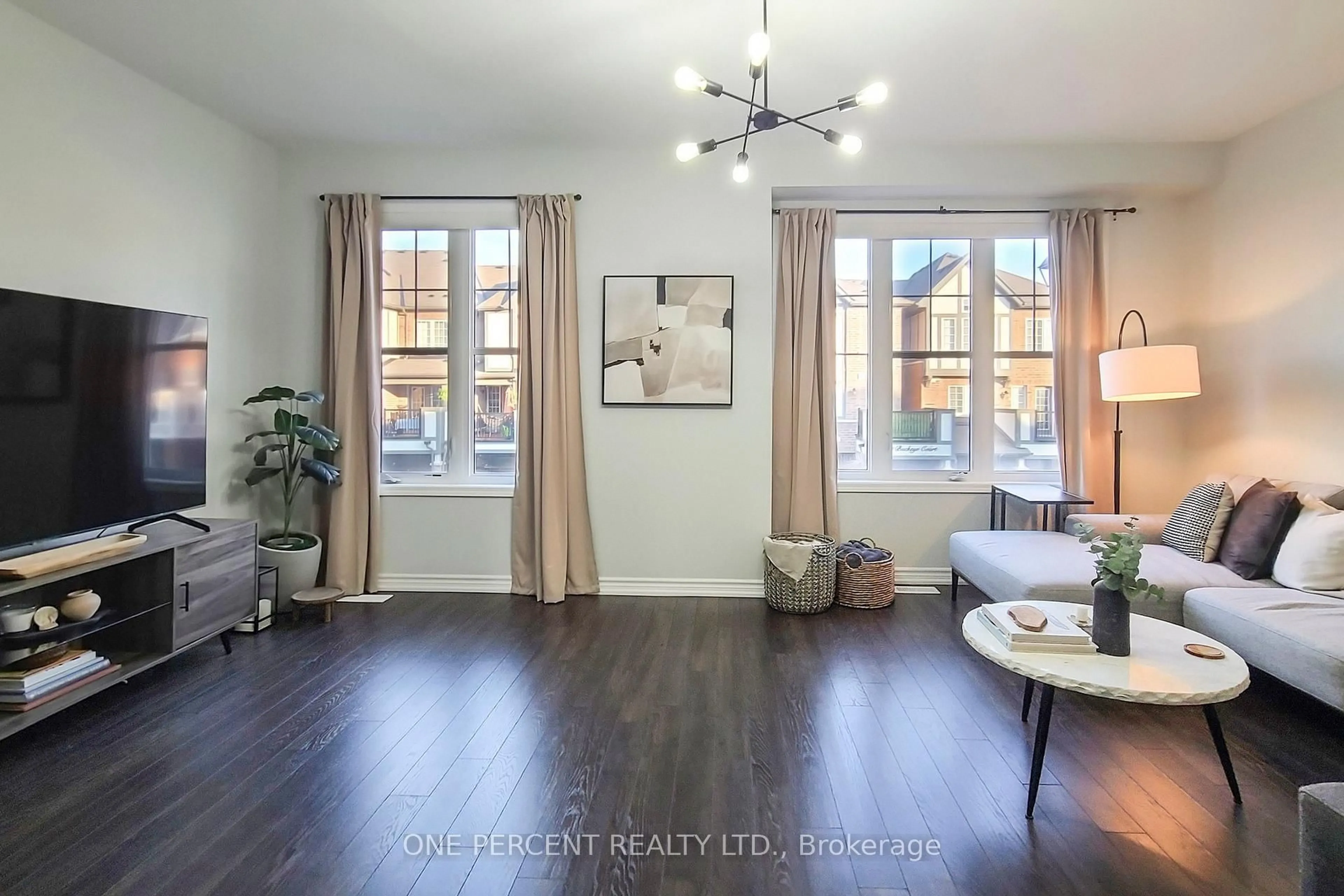 Living room with furniture, wood/laminate floor for 501 Buckeye Crt #25, Milton Ontario L9E 1P3
