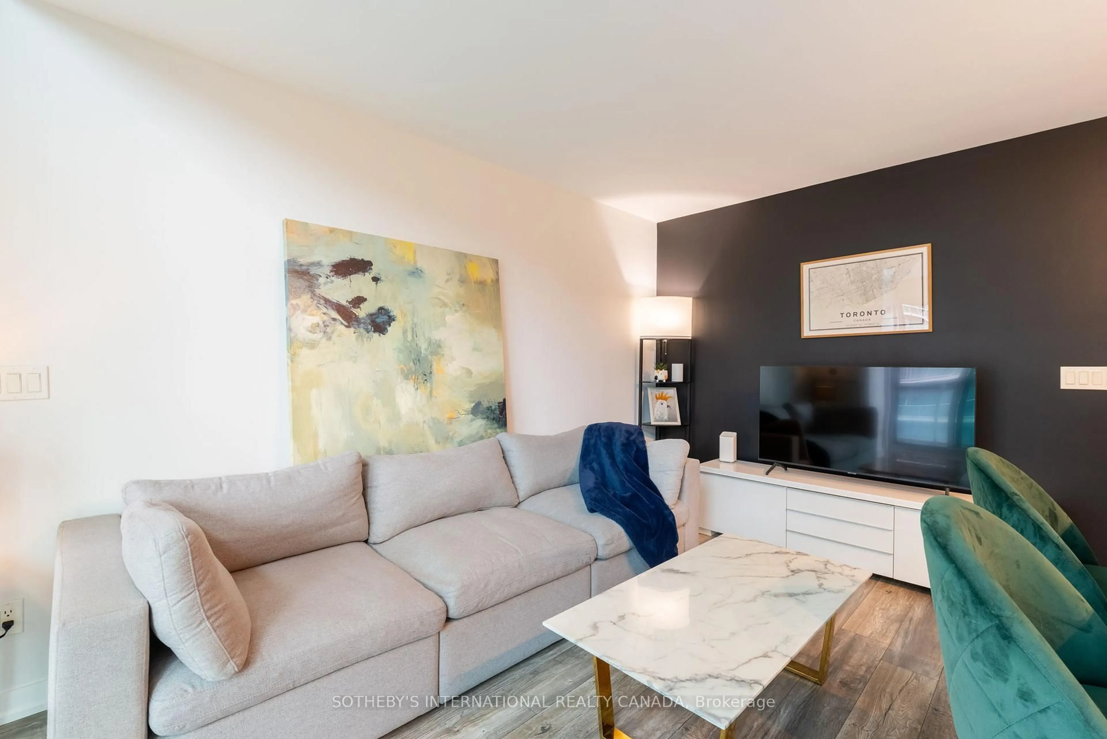 Living room with furniture, wood/laminate floor for 155 Legion Rd #706, Toronto Ontario M8Y 0A7