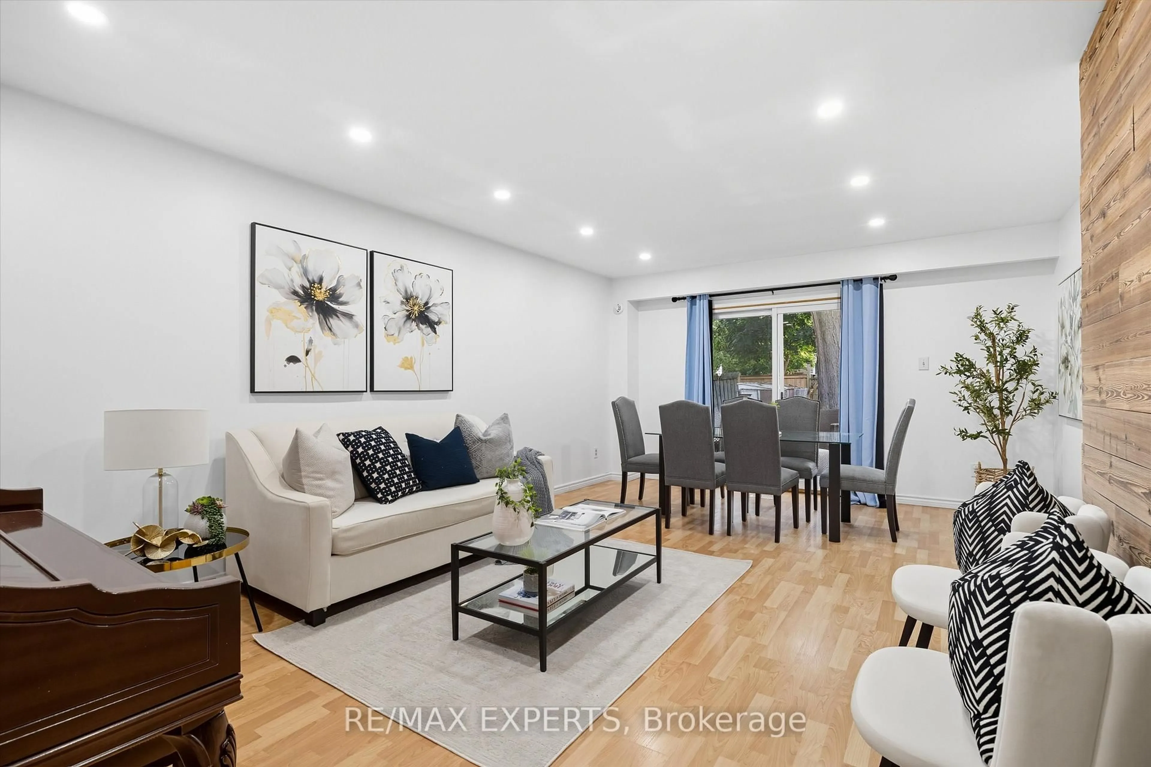 Living room with furniture, wood/laminate floor for 36 Nancy Mccredie Dr, Brampton Ontario L6X 2N5