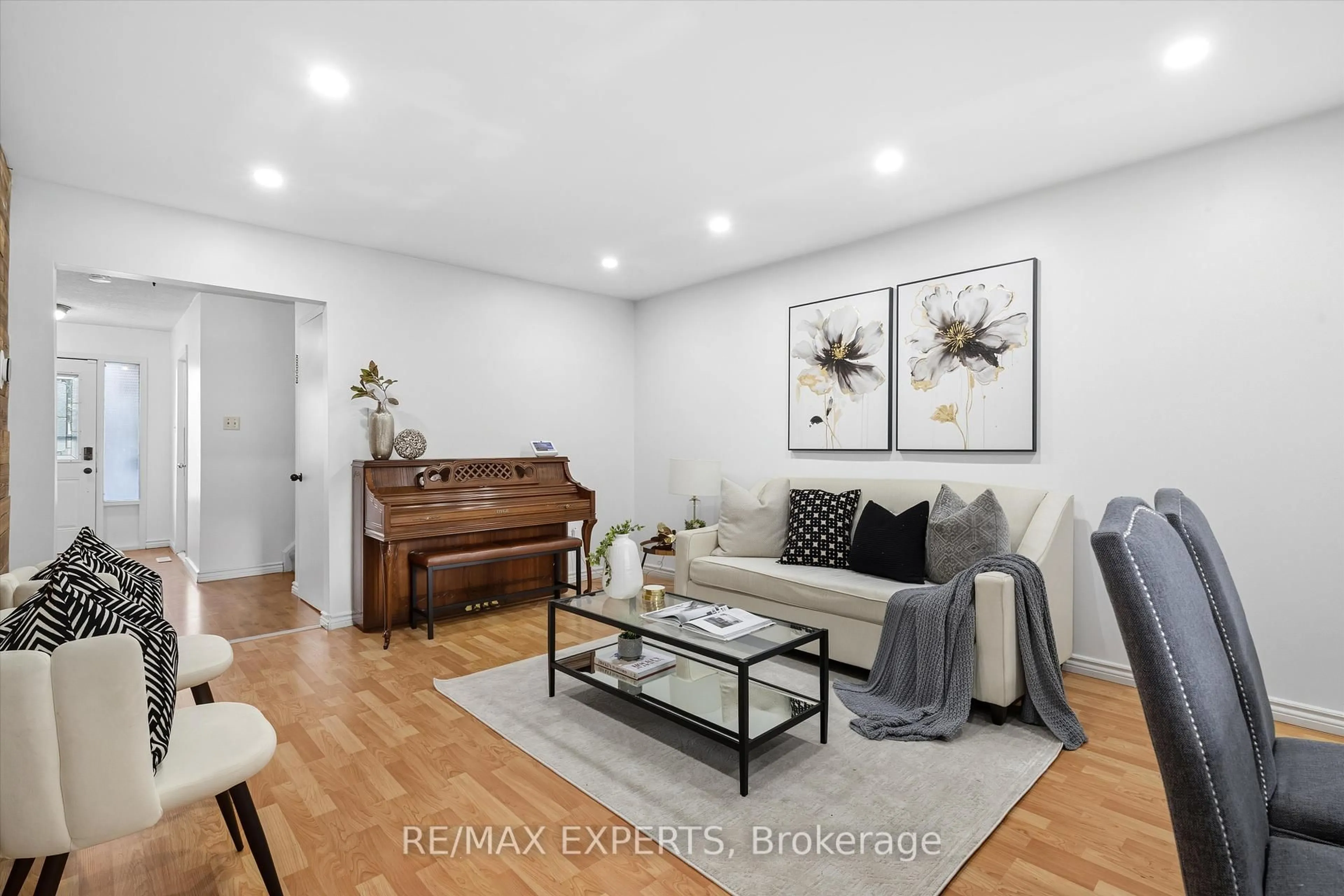 Living room with furniture, wood/laminate floor for 36 Nancy Mccredie Dr, Brampton Ontario L6X 2N5