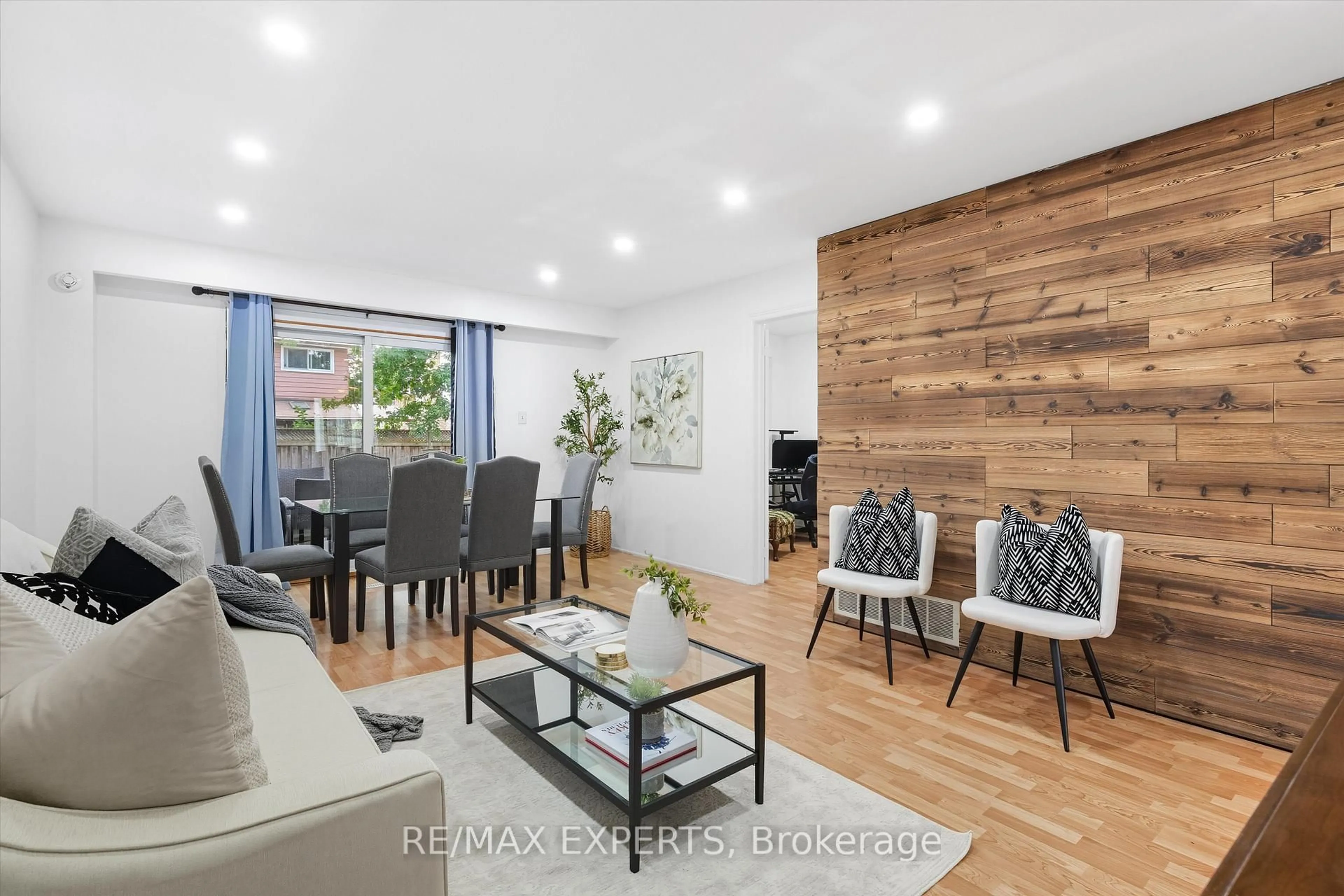 Living room with furniture, wood/laminate floor for 36 Nancy Mccredie Dr, Brampton Ontario L6X 2N5
