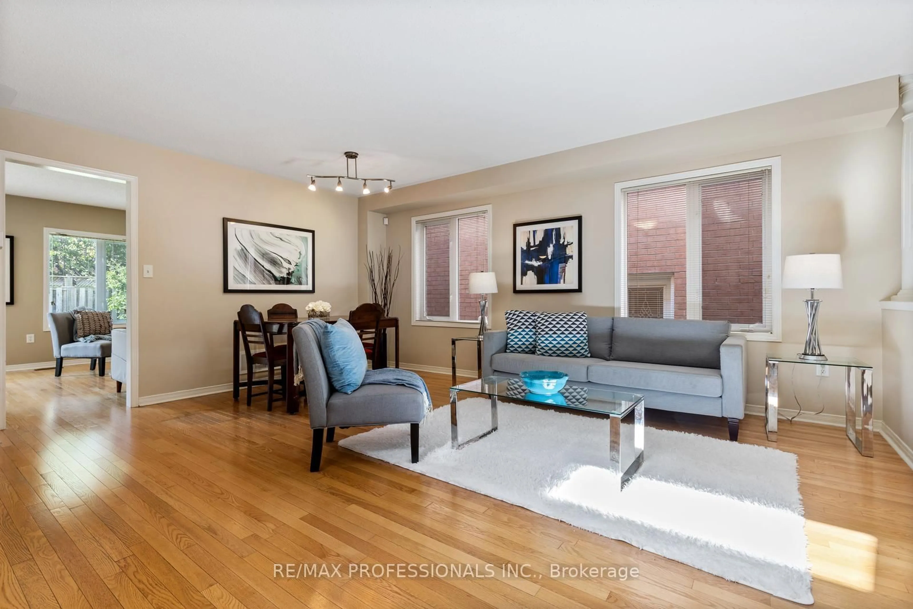 Living room with furniture, wood/laminate floor for 4808 Half Moon Grve, Mississauga Ontario L5M 7R7