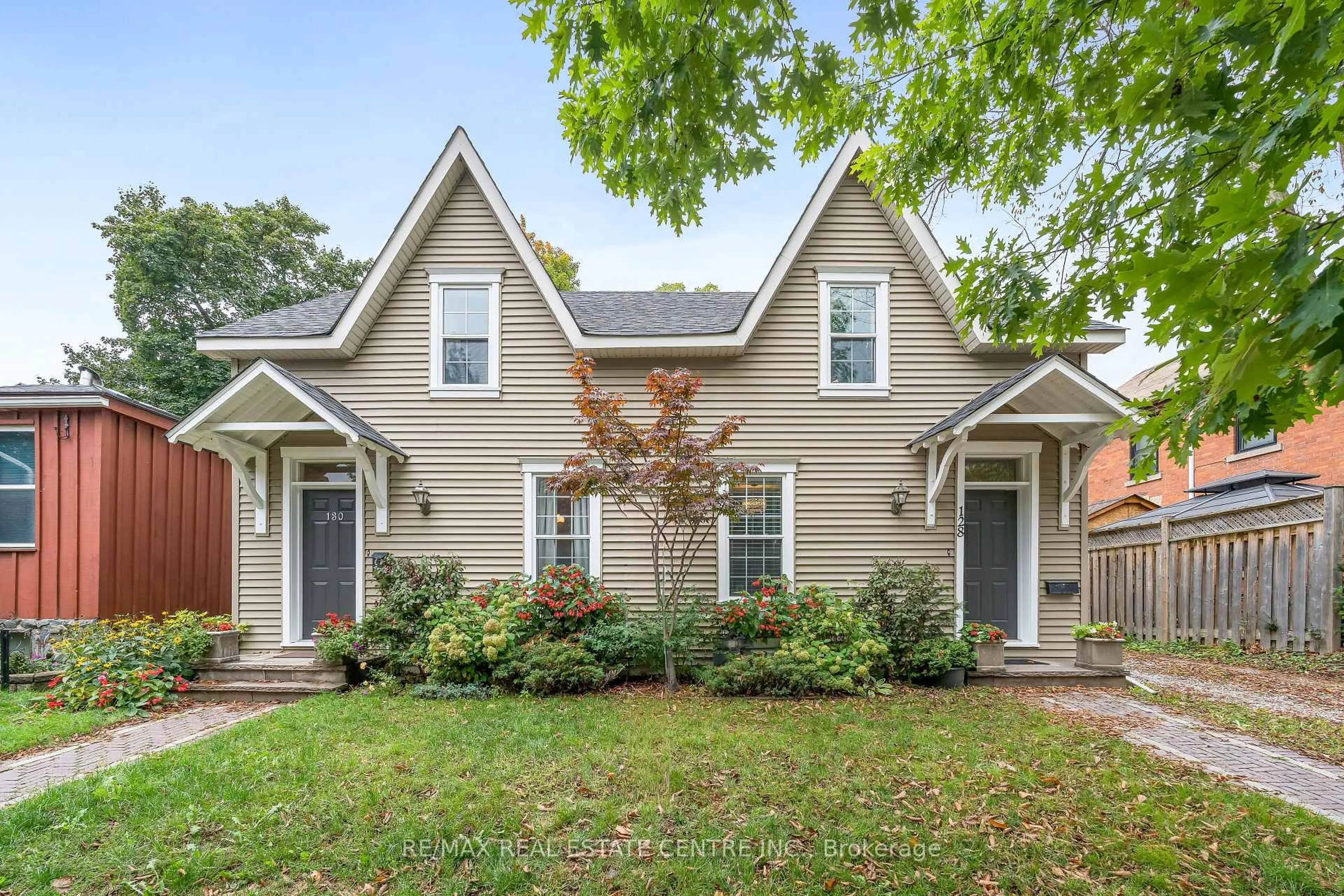 Home with vinyl exterior material, street for 128-130 Main St, Halton Hills Ontario L7G 3E6