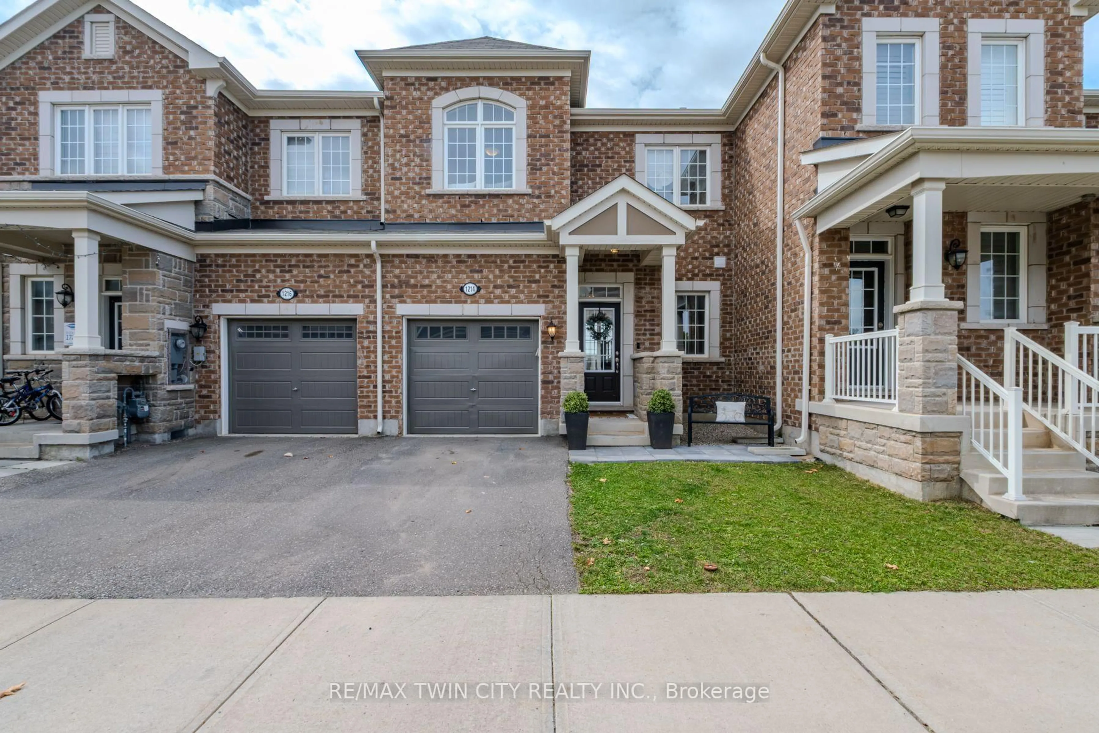 Home with brick exterior material, street for 1214 Rose Way, Milton Ontario L9E 1L9