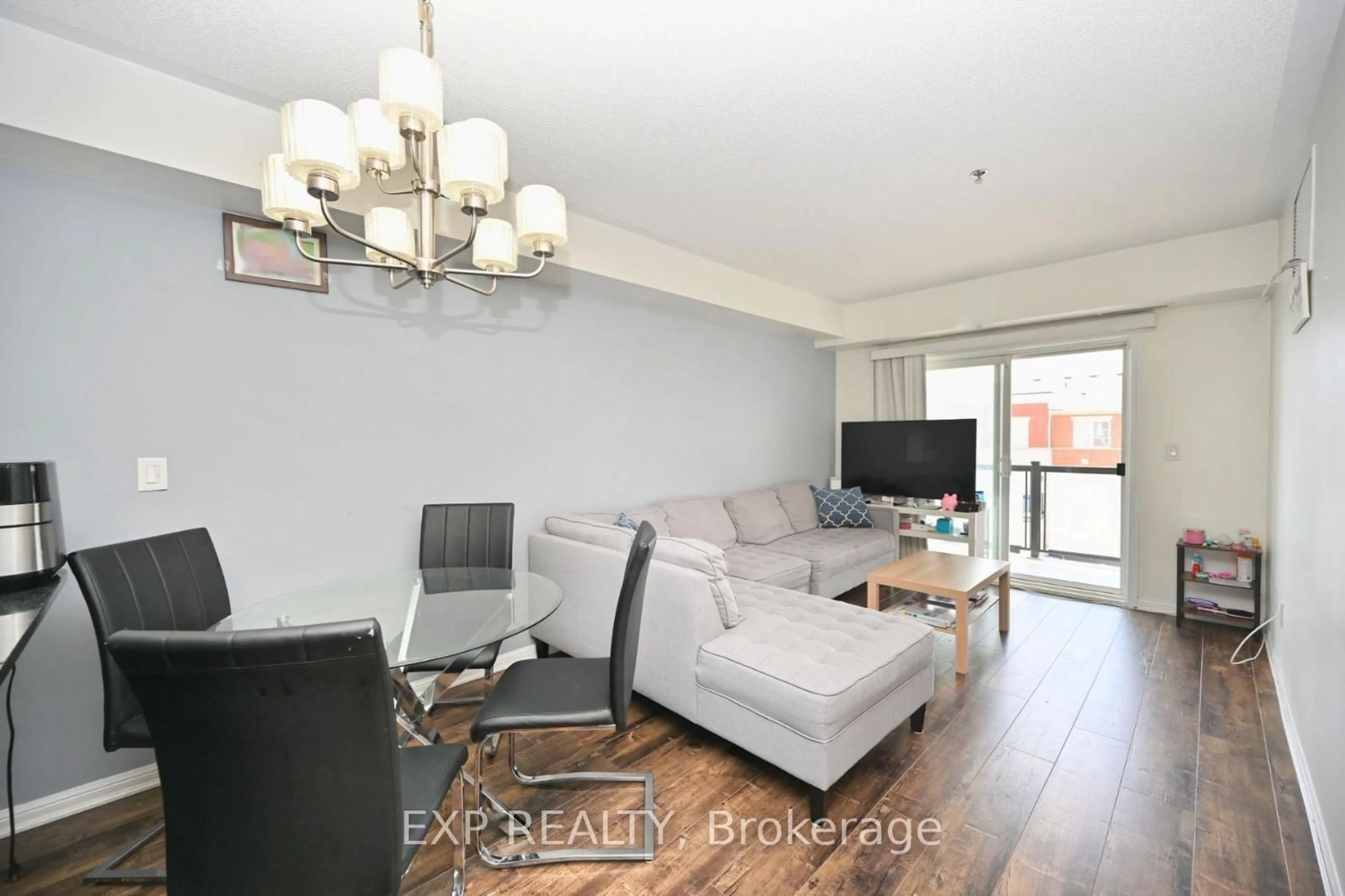 Living room with furniture, wood/laminate floor for 70 Baycliffe Cres #301, Brampton Ontario L7A 3Z4