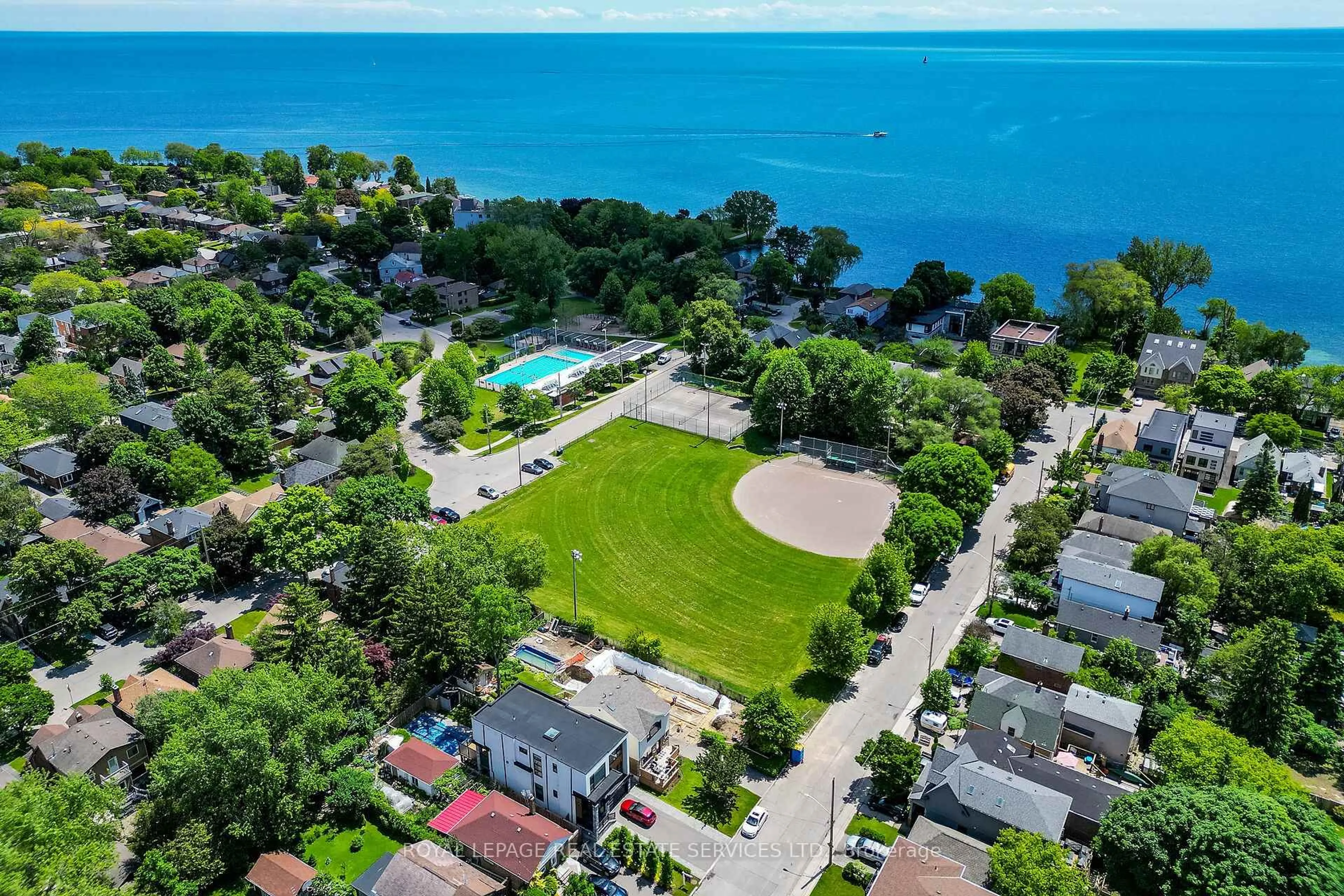A pic from outside/outdoor area/front of a property/back of a property/a pic from drone, water/lake/river/ocean view for 6 Twelfth St, Toronto Ontario M8V 3G7