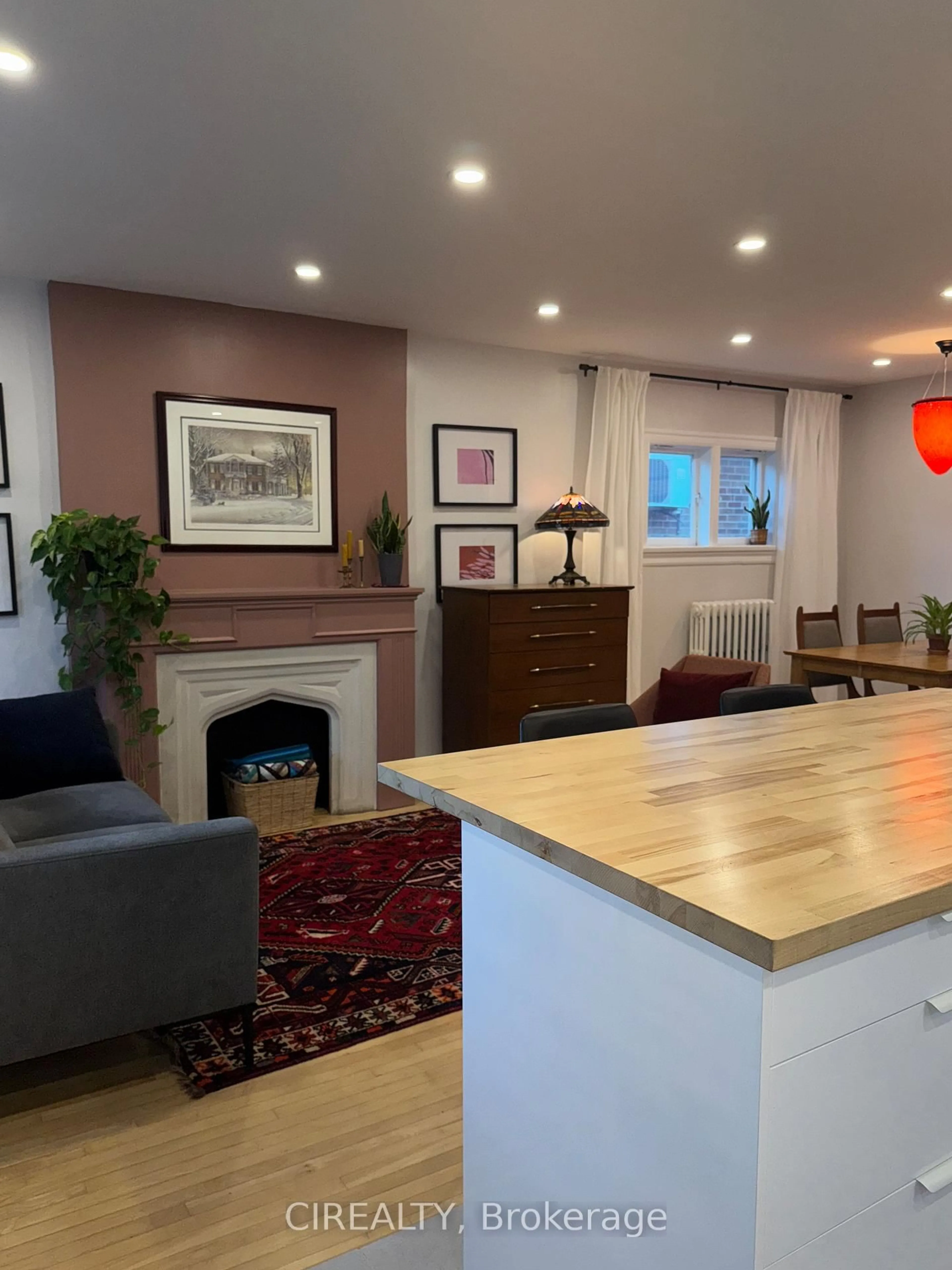 Living room with furniture, wood/laminate floor for 140 Ellins Ave, Toronto Ontario M6N 2B1