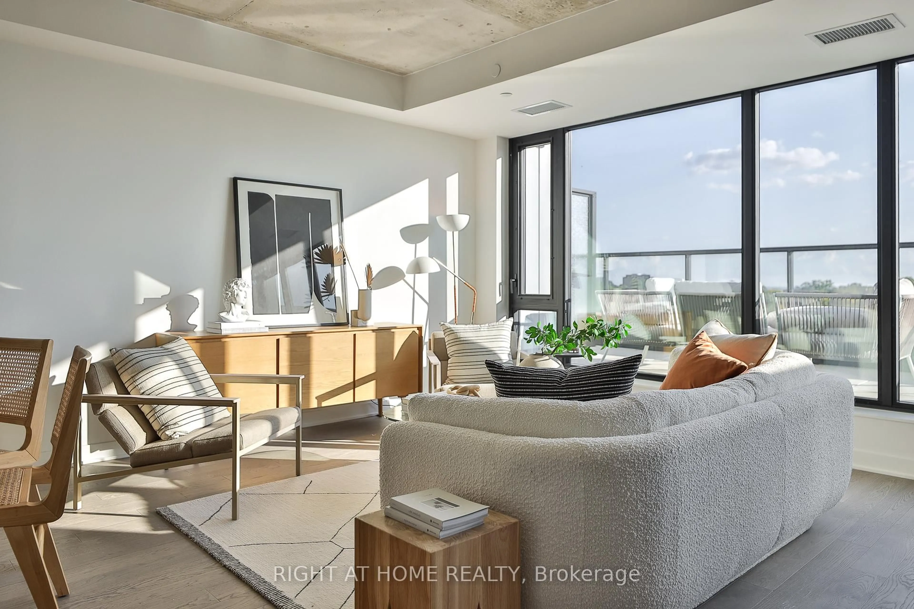 Living room with furniture, cement floor for 2720 Dundas St #607, Toronto Ontario M6P 1Y2