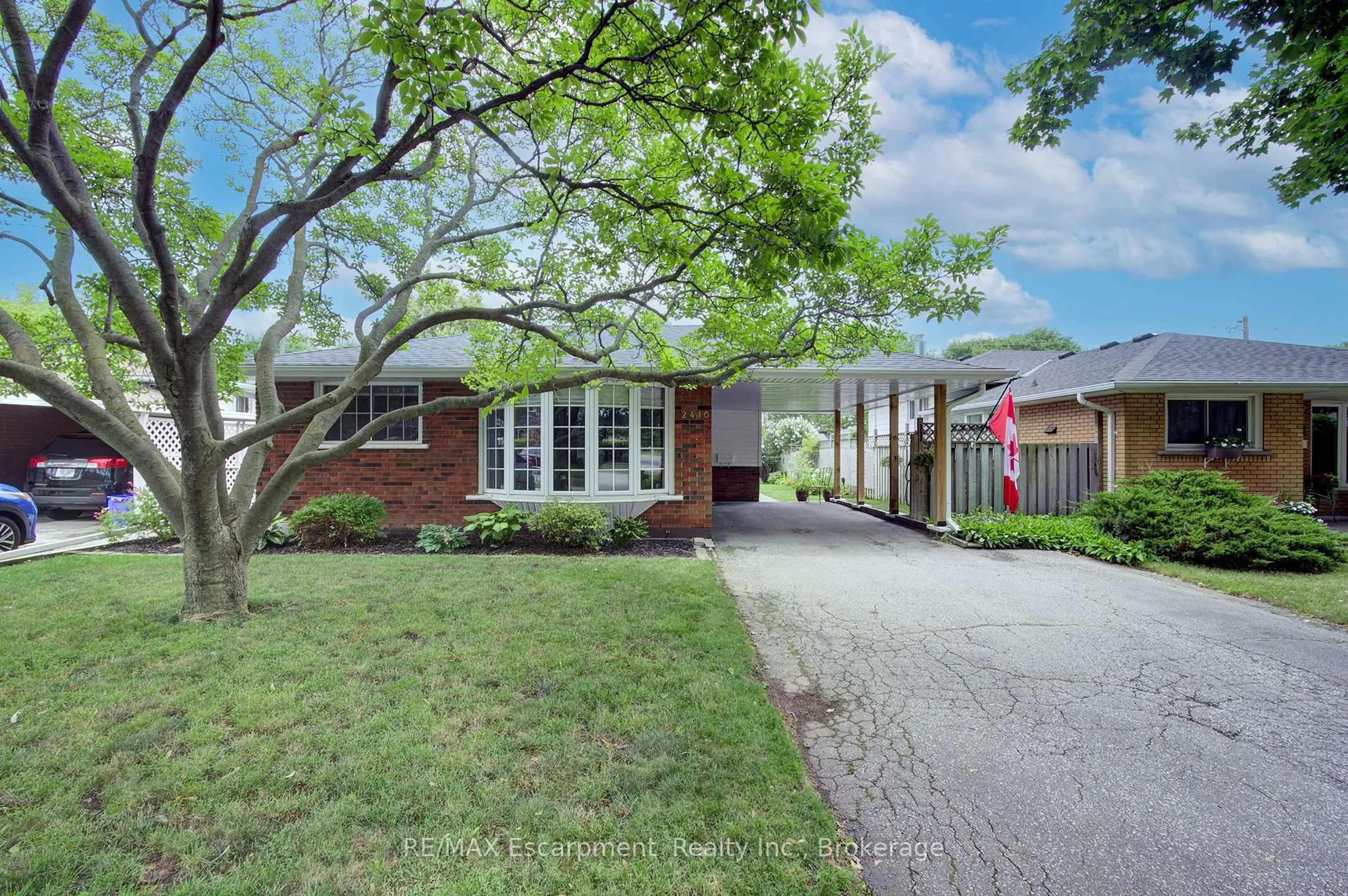 Home with brick exterior material, street for 2410 Tait Ave, Burlington Ontario L7P 1H1