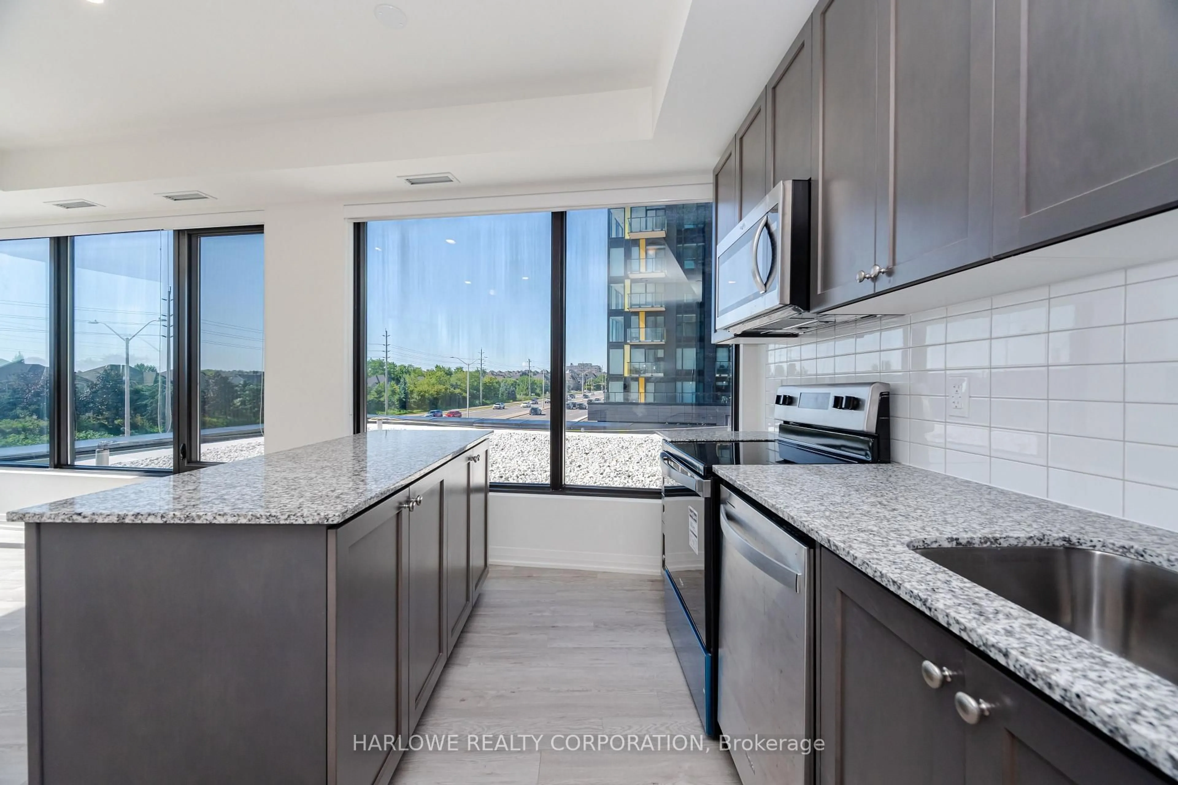 Open concept kitchen, ceramic/tile floor for 1415 Dundas St #217, Oakville Ontario L6H 8A3