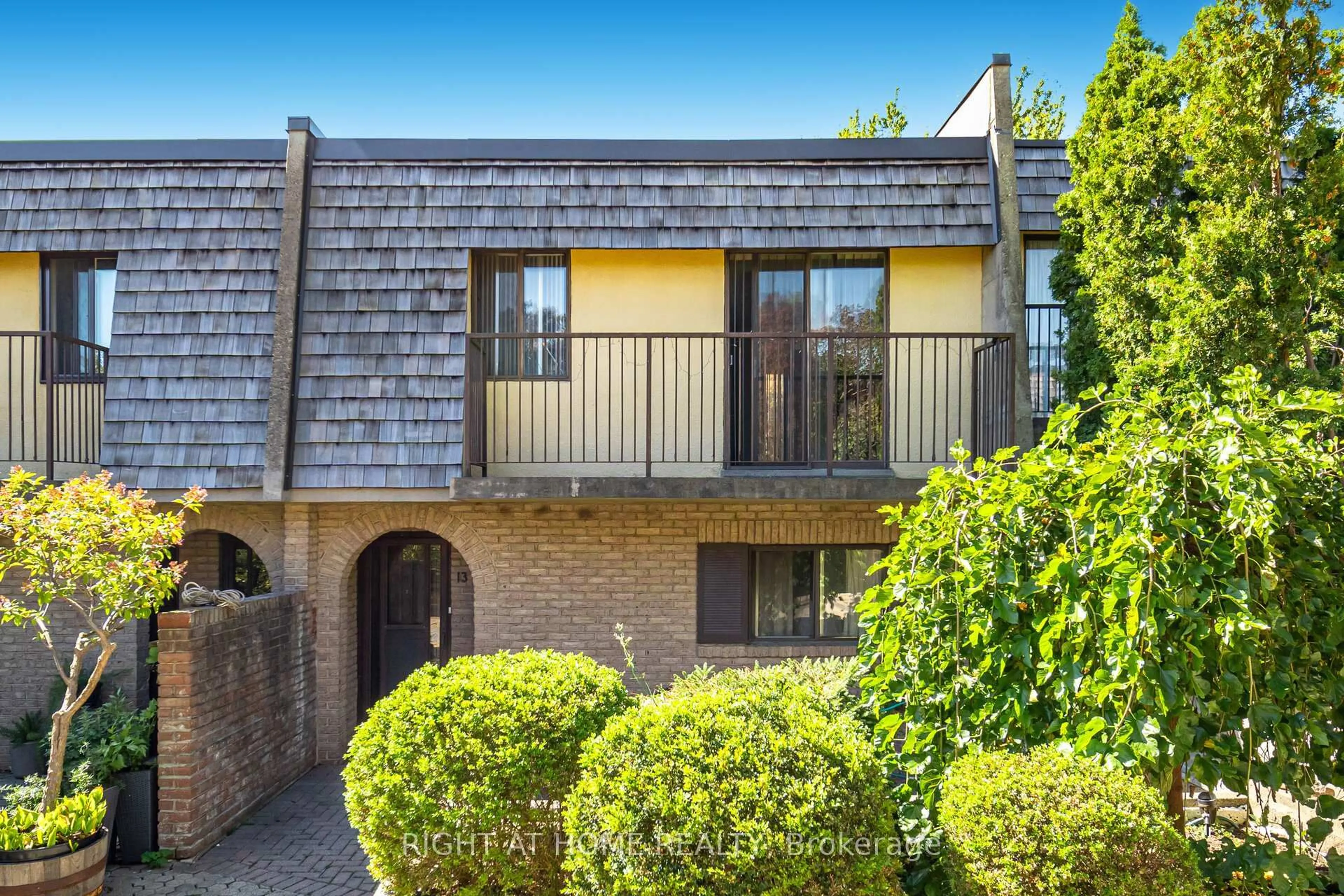A pic from outside/outdoor area/front of a property/back of a property/a pic from drone, street for 1250 Mississauga Valley Blvd #13, Mississauga Ontario L5M 6K8