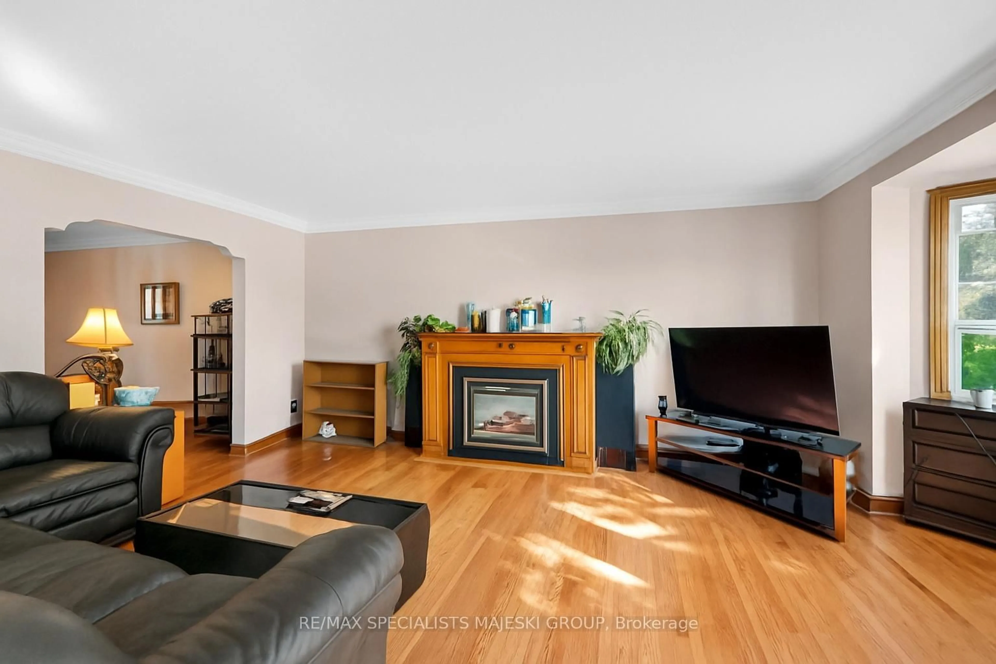 Living room with furniture, wood/laminate floor for 50 Twenty Third St, Toronto Ontario M8V 3M6