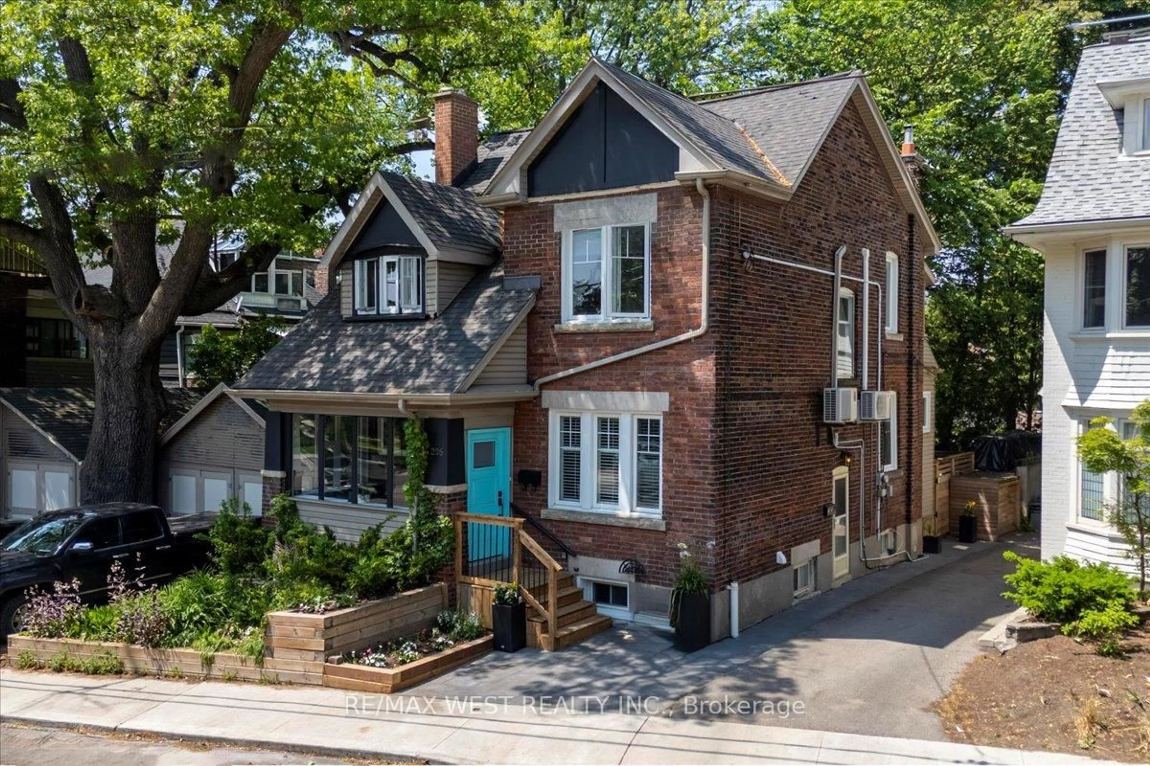 Home with brick exterior material, street for 206 Howard Park Ave, Toronto Ontario M6R 1W1
