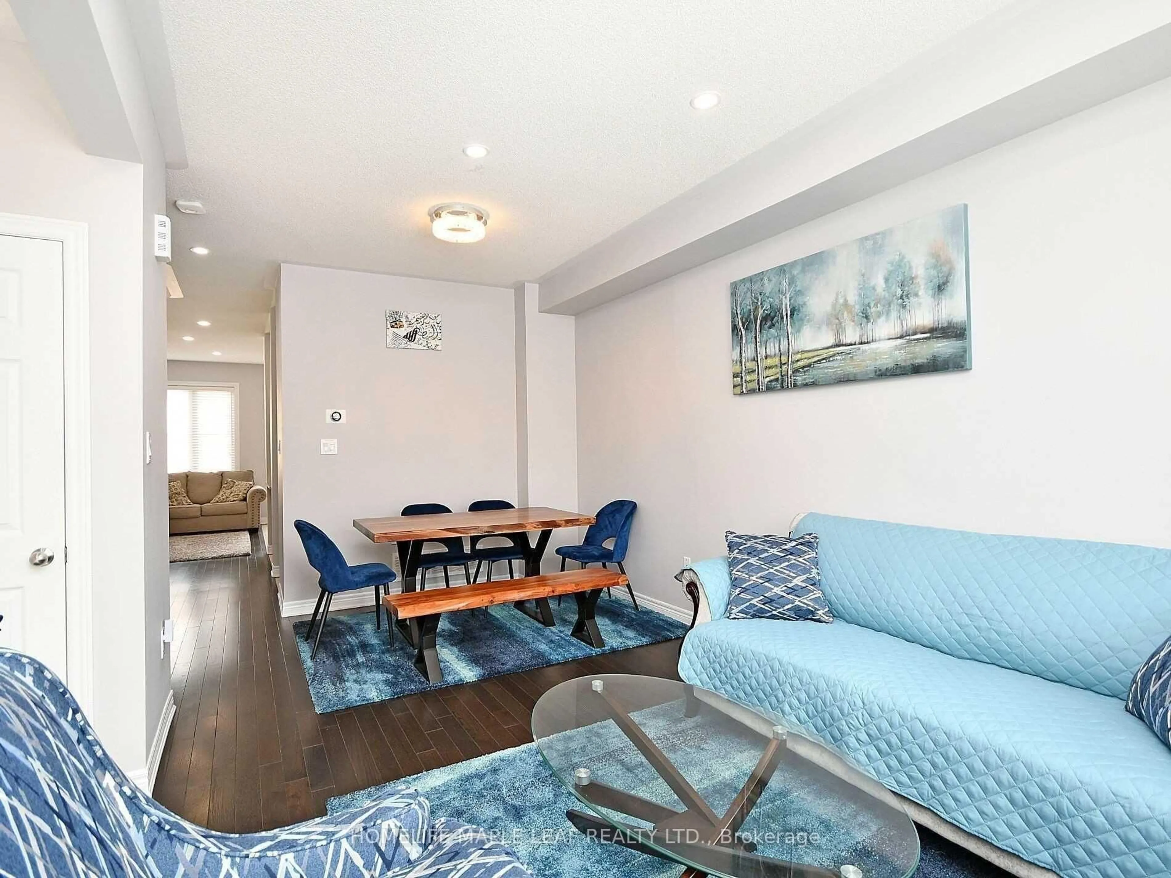 Living room with furniture, wood/laminate floor for 76 Rockman Cres, Brampton Ontario L7A 3Z9