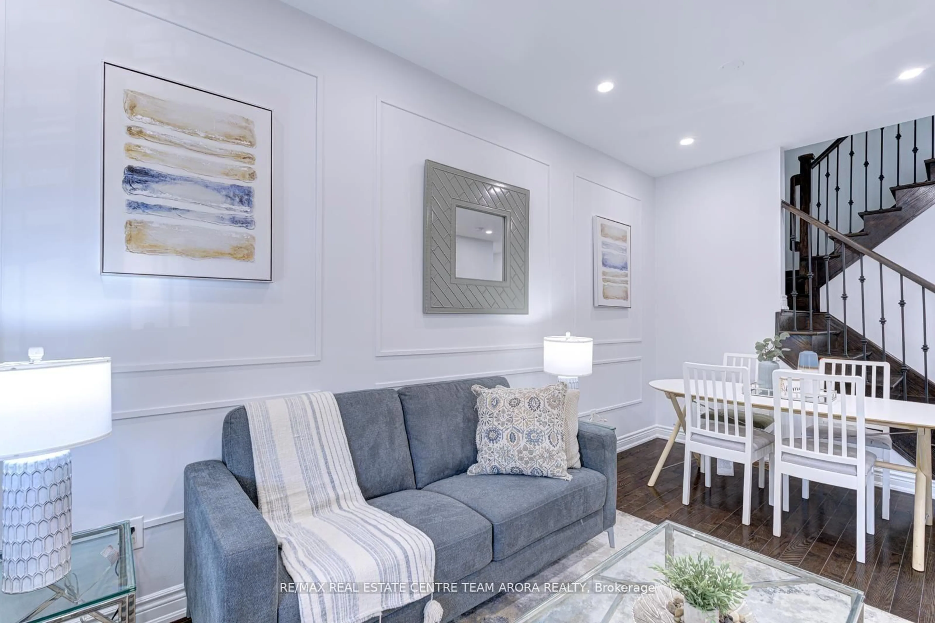Living room with furniture, wood/laminate floor for 57 Sky Harbour Dr, Brampton Ontario L6Y 0V3