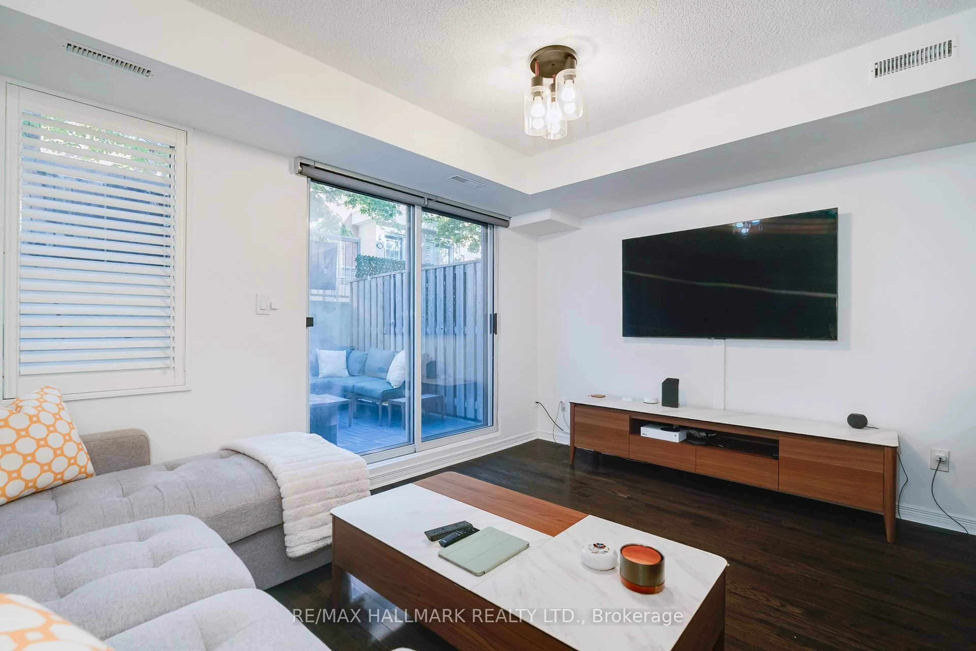 Living room with furniture, wood/laminate floor for 20 Foundry Ave #113, Toronto Ontario M6H 4L1