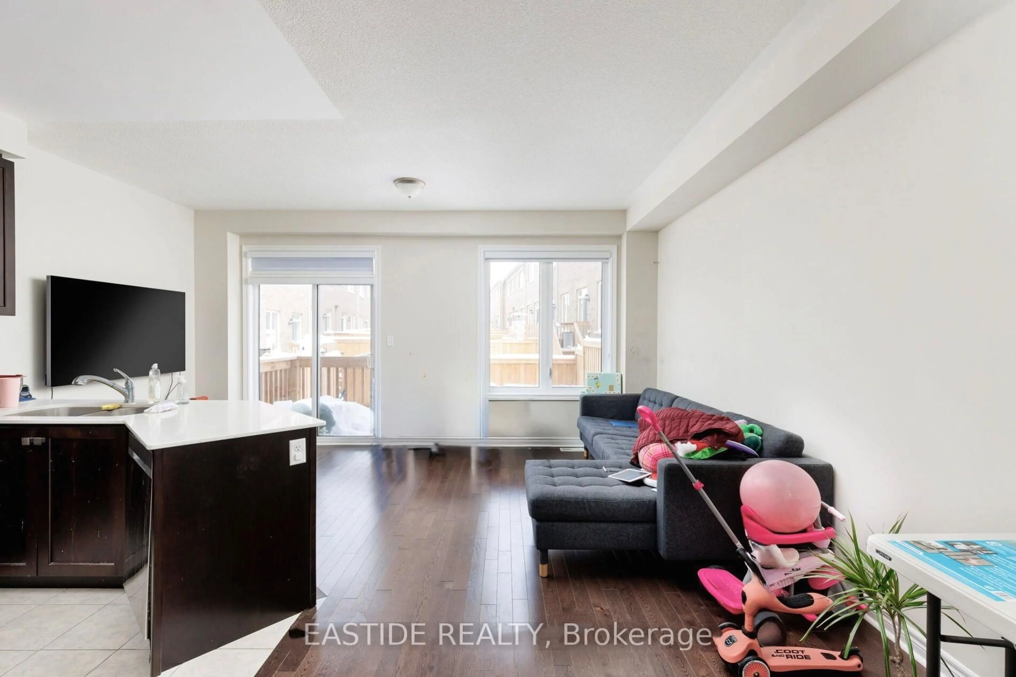 Living room with furniture, wood/laminate floor for 57 Benhurst Cres, Brampton Ontario L7A 0B7