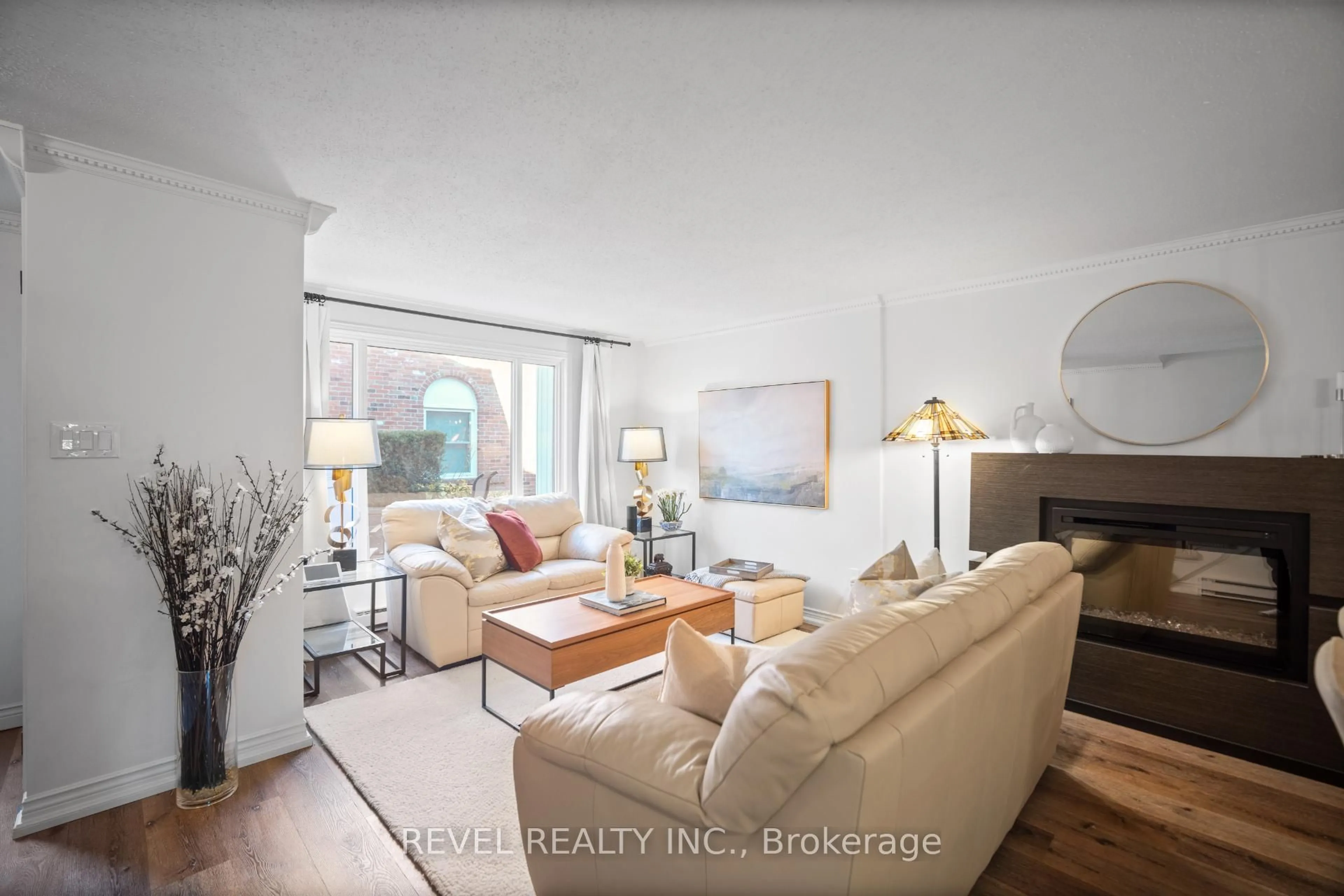 Living room with furniture, wood/laminate floor for 2058 Brant St #3, Burlington Ontario L7P 3A6