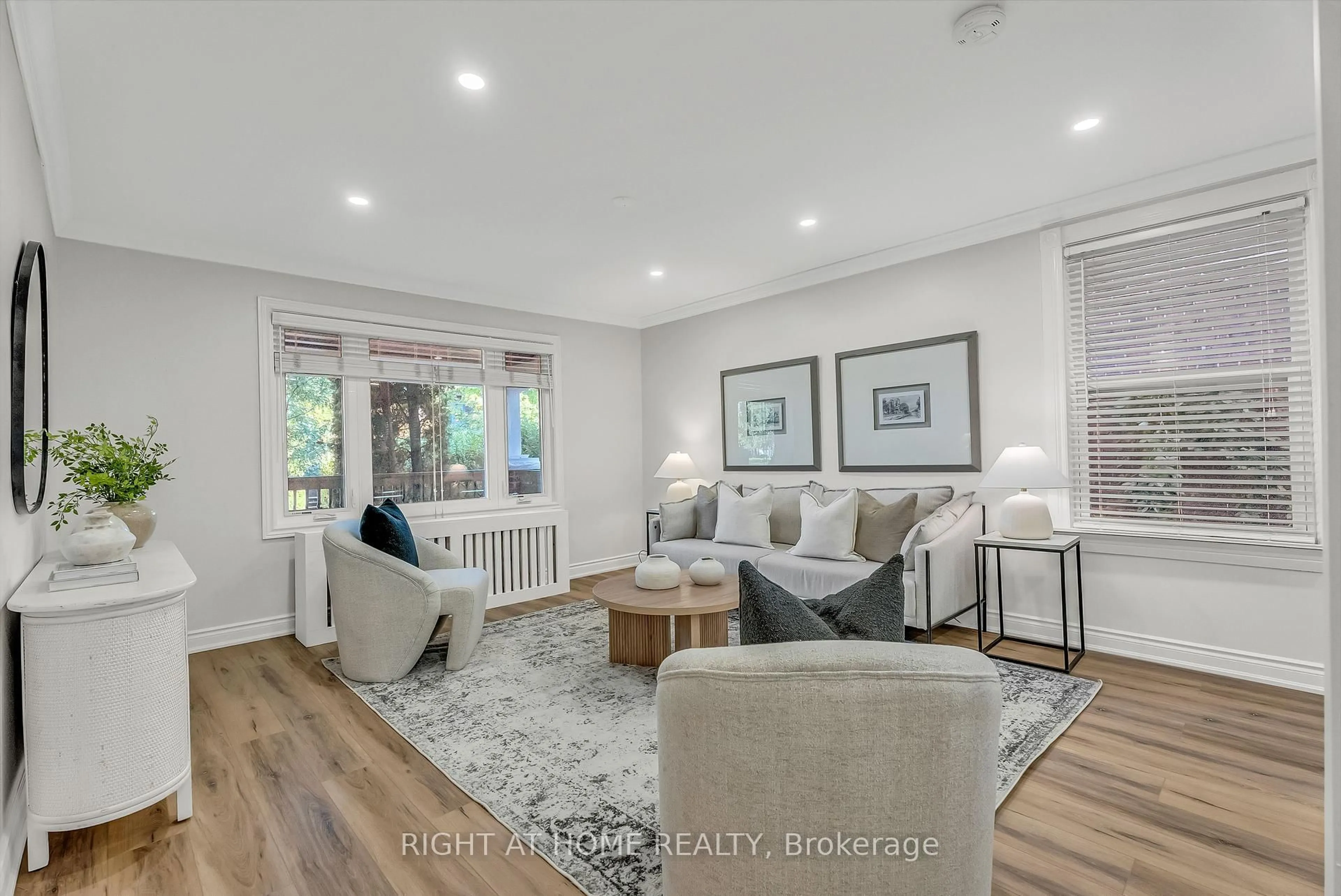 Living room with furniture, wood/laminate floor for 232 Sixth St, Toronto Ontario M8V 3A7