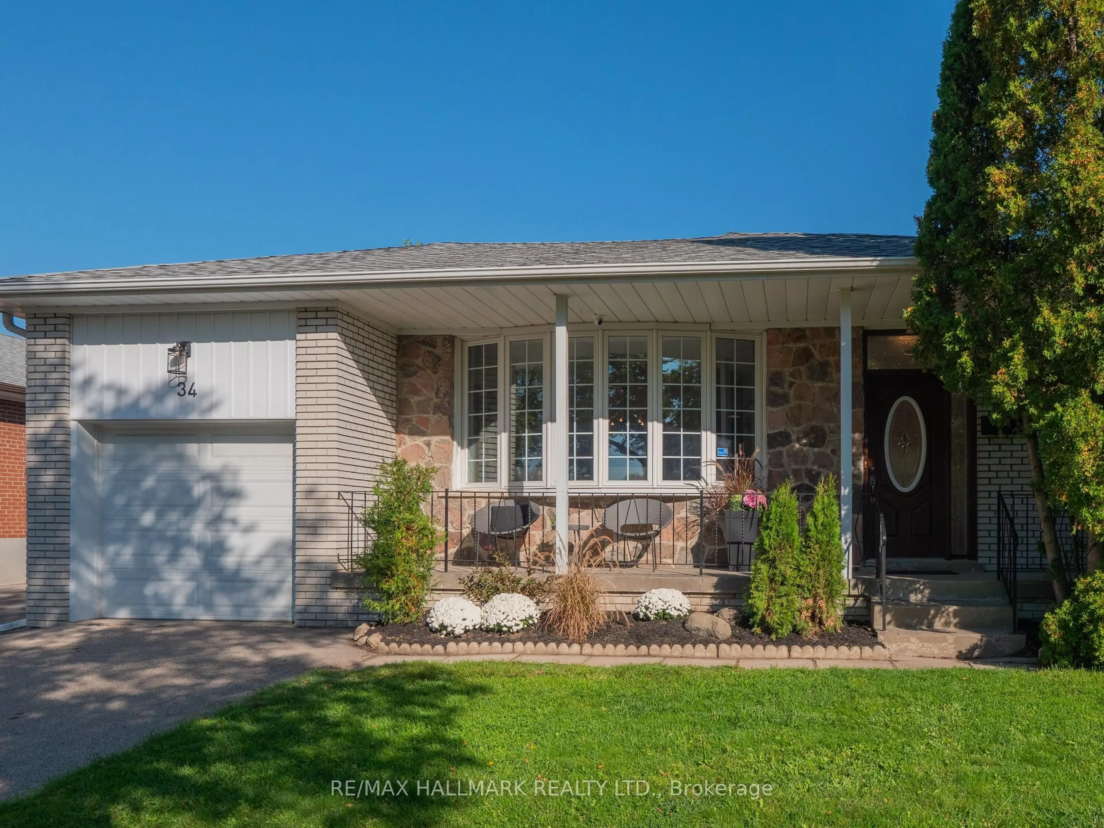 Home with vinyl exterior material, street for 34 Guernsey Dr, Toronto Ontario M9C 3A6