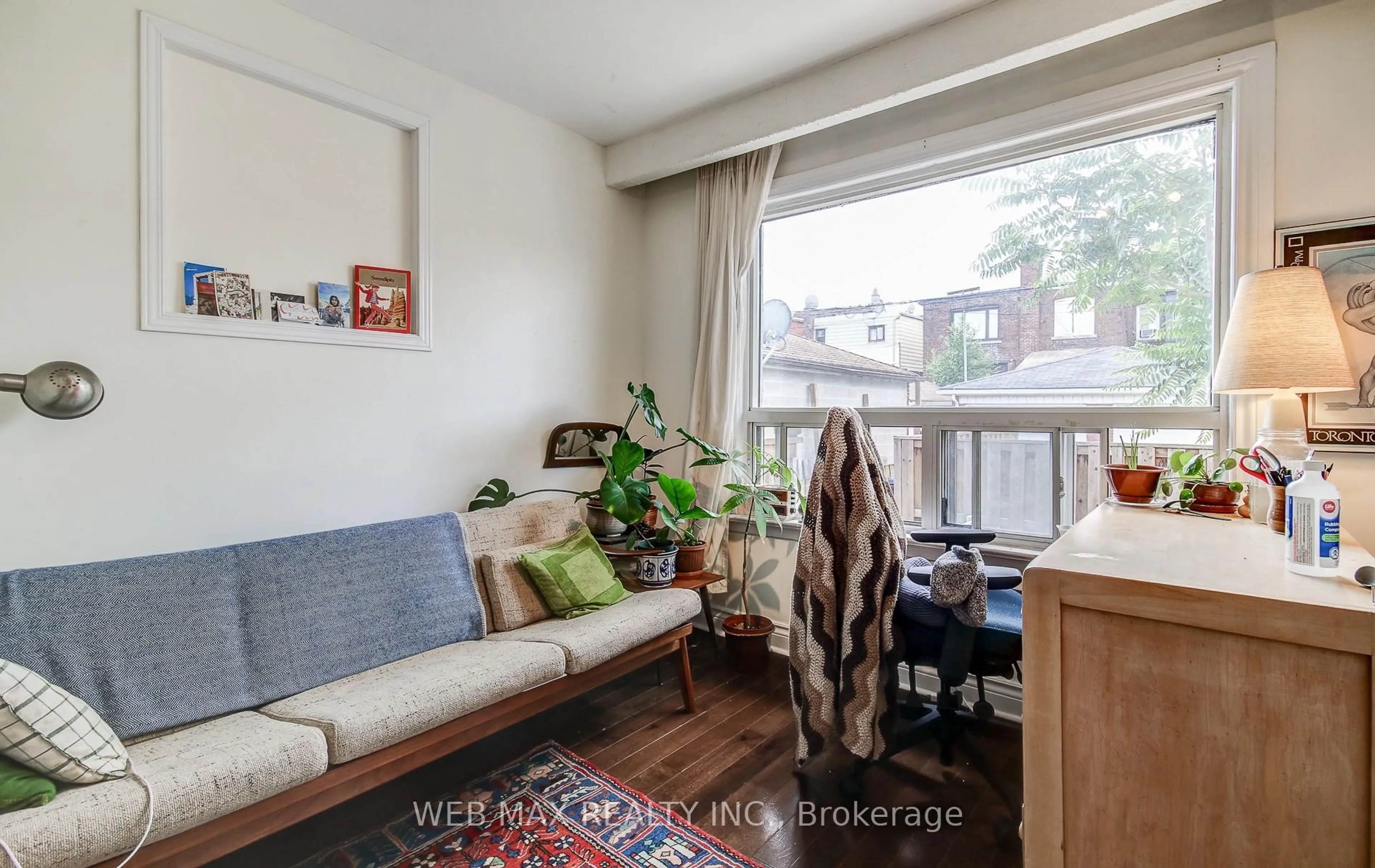 Living room with furniture, wood/laminate floor for 50 Sellers Ave, Toronto Ontario M6E 3T6