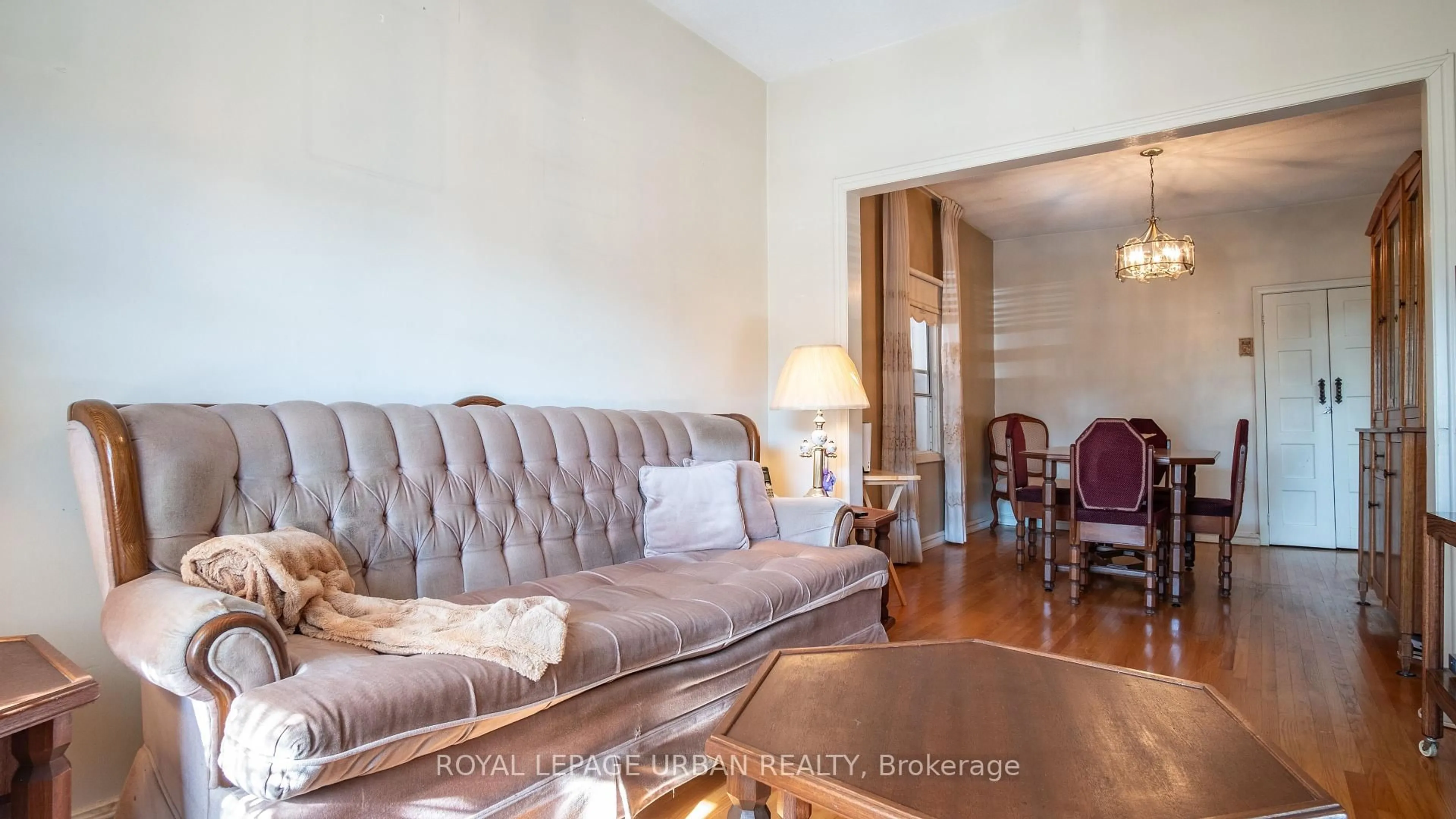 Living room with furniture, wood/laminate floor for 173 Ennerdale Rd, Toronto Ontario M6E 4C8