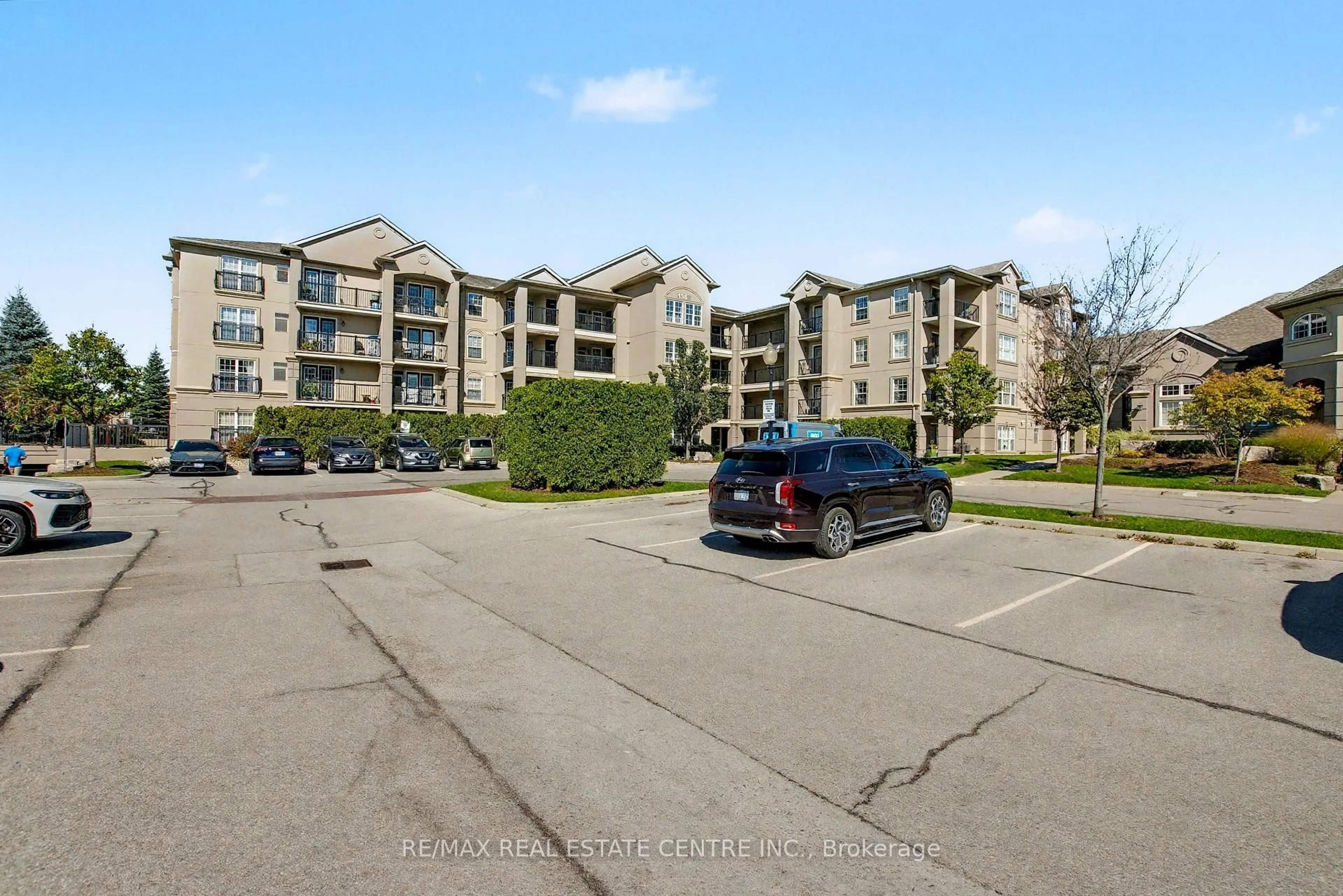 A pic from outside/outdoor area/front of a property/back of a property/a pic from drone, unknown for 1380 Main St #204, Milton Ontario L9T 7S4