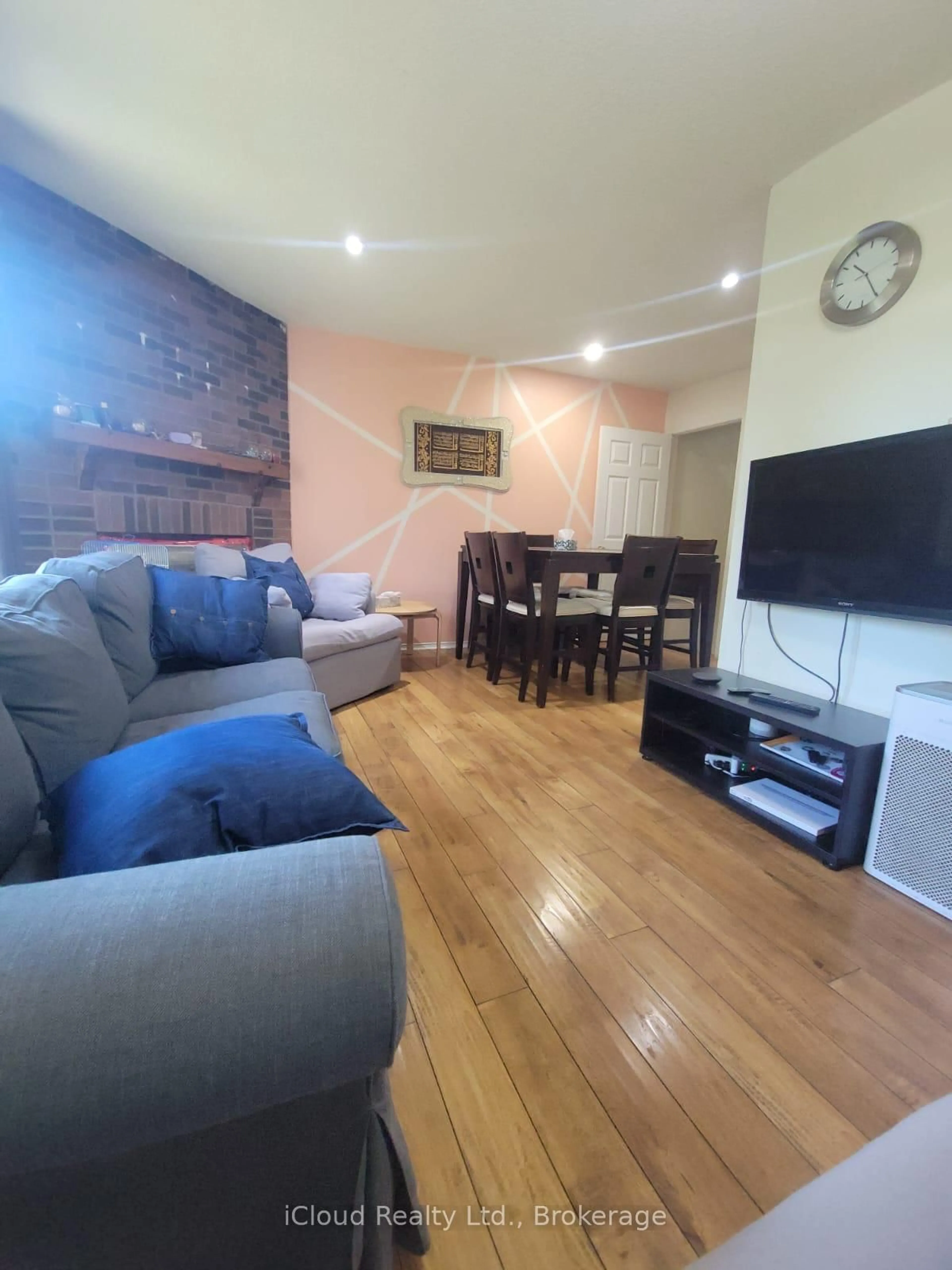 Living room with furniture, wood/laminate floor for 4711 Full Moon Circ, Mississauga Ontario L4Z 2L8
