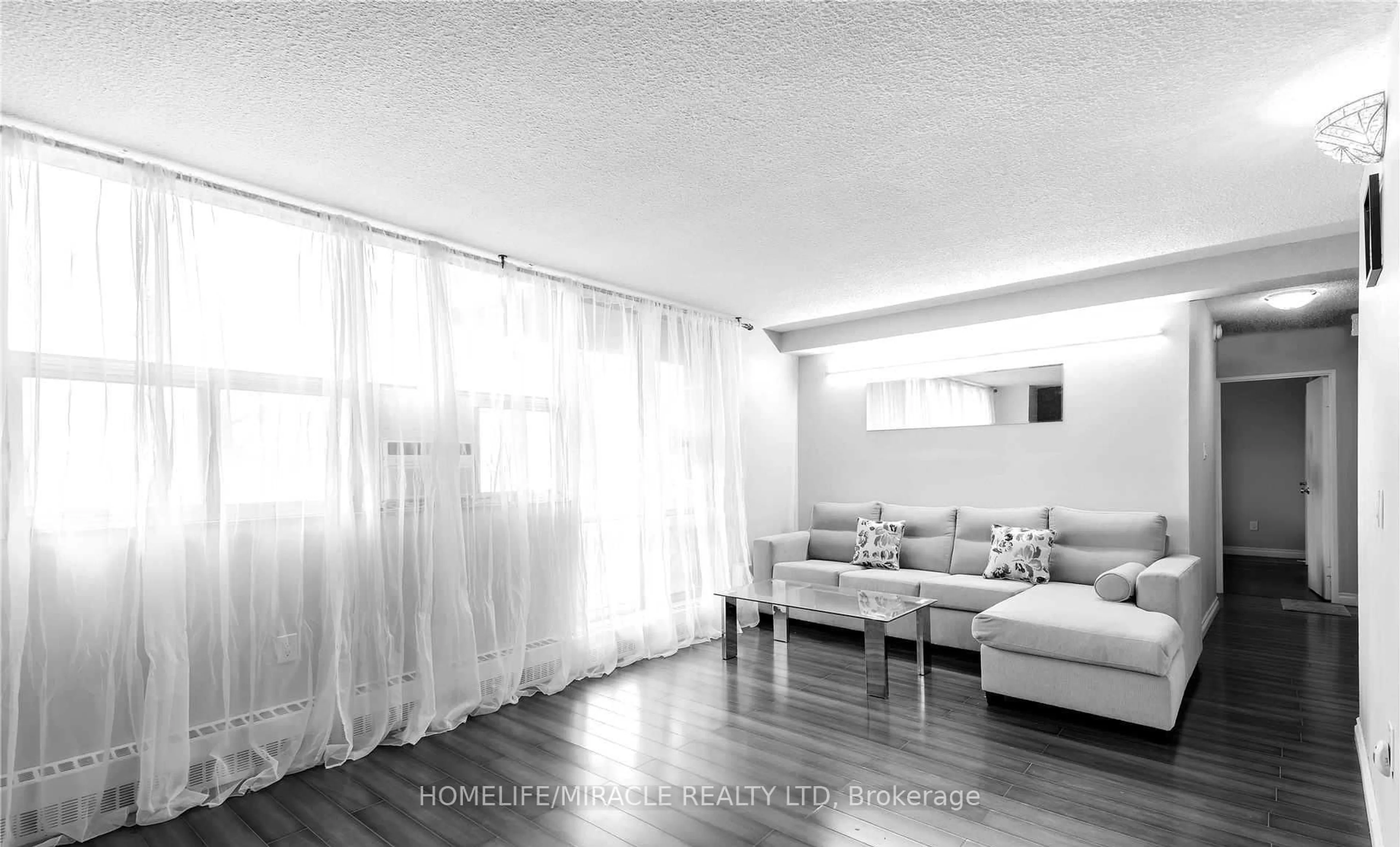 Living room with furniture, wood/laminate floor for 2645 Kipling Ave #404, Toronto Ontario M9V 3S6