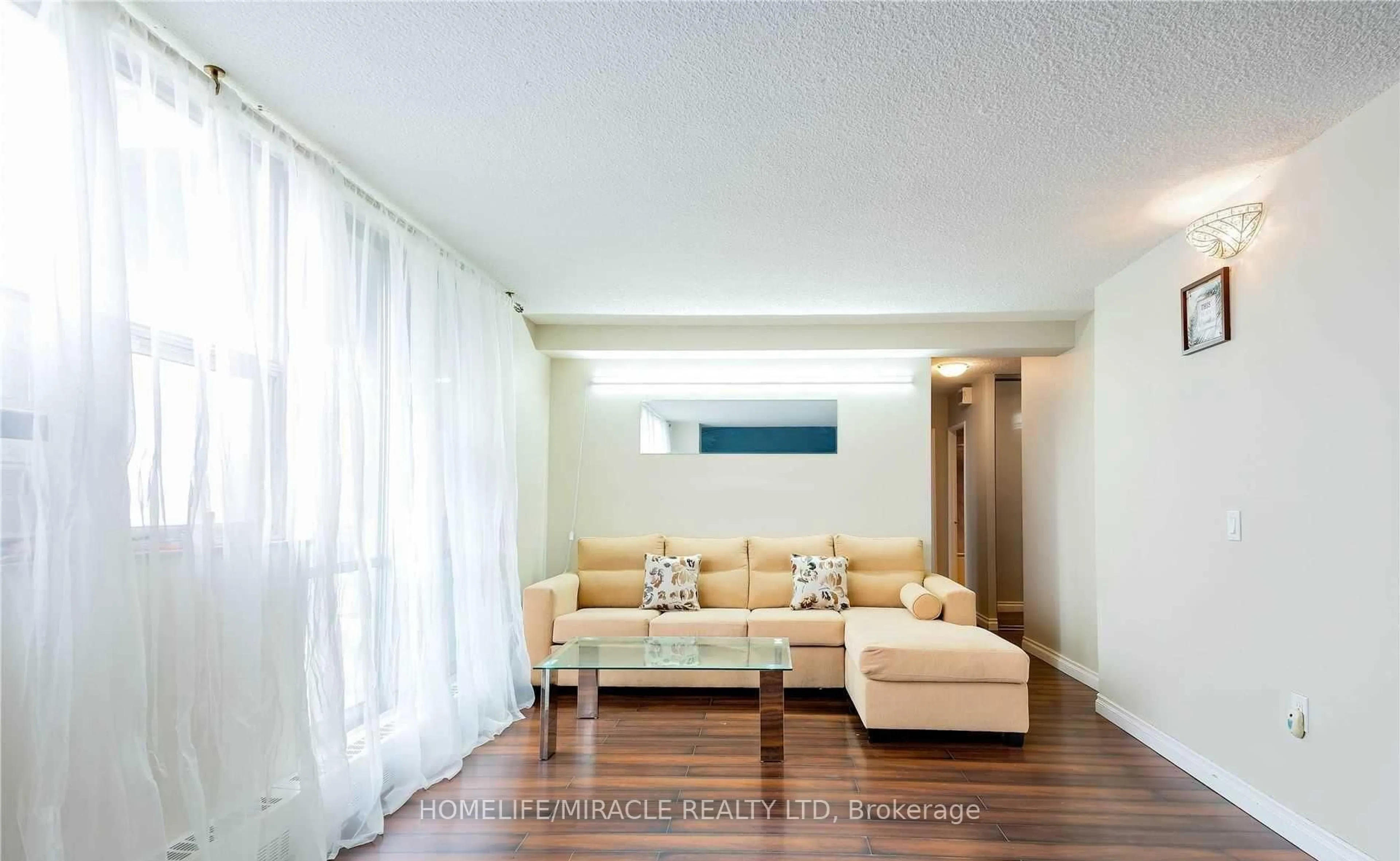 Living room with furniture, wood/laminate floor for 2645 Kipling Ave #404, Toronto Ontario M9V 3S6