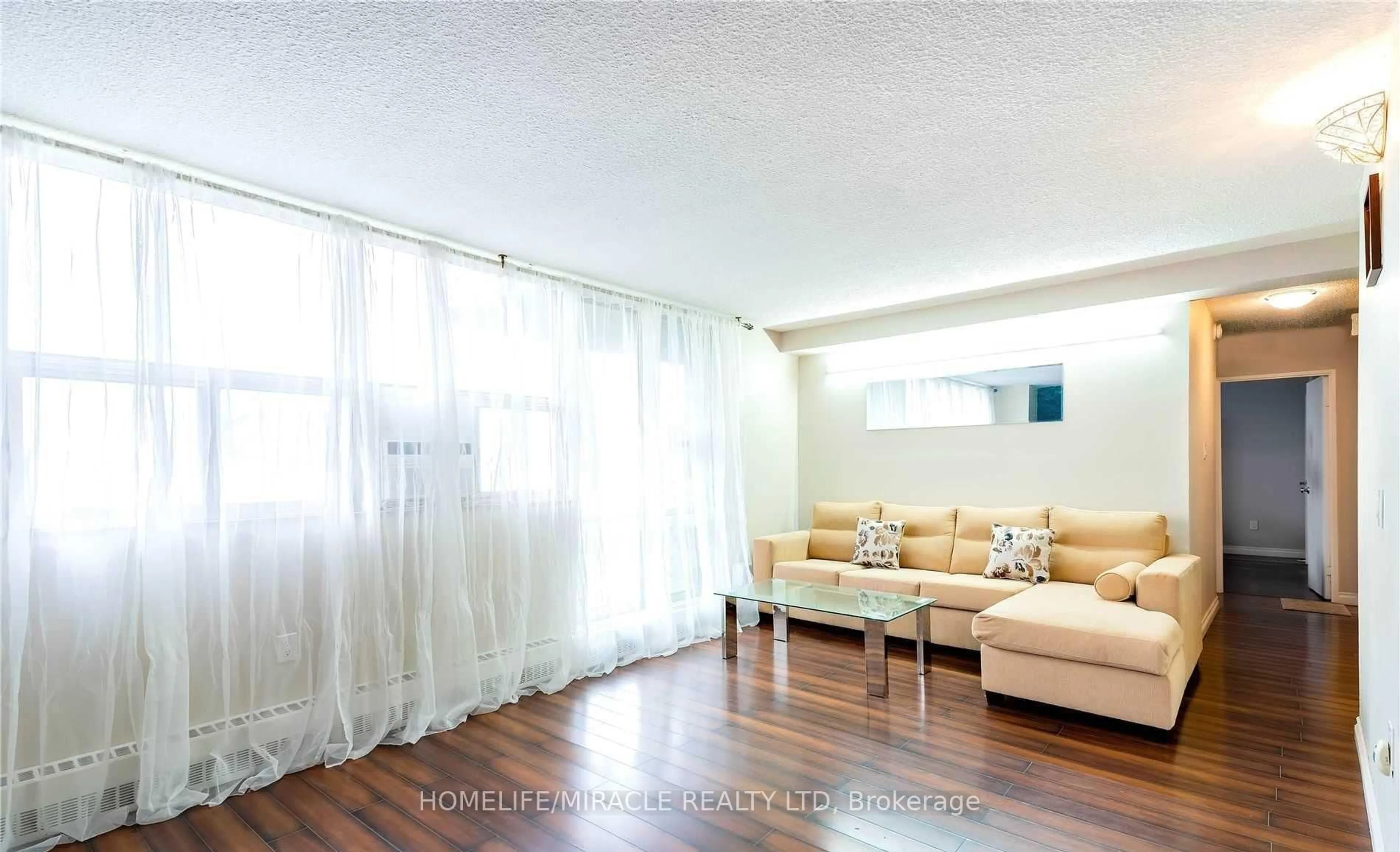 Living room with furniture, wood/laminate floor for 2645 Kipling Ave #404, Toronto Ontario M9V 3S6