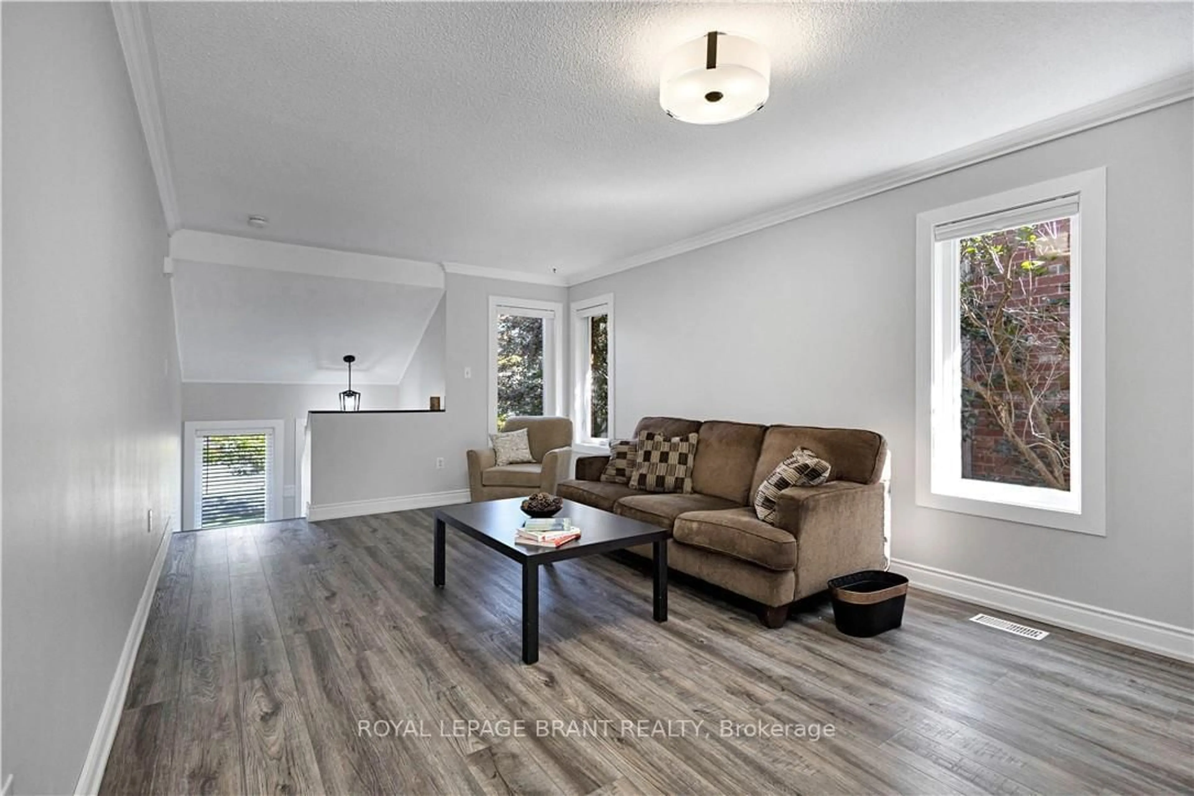 Living room with furniture, wood/laminate floor for 10 Harley Ave, Halton Hills Ontario L7G 5R8