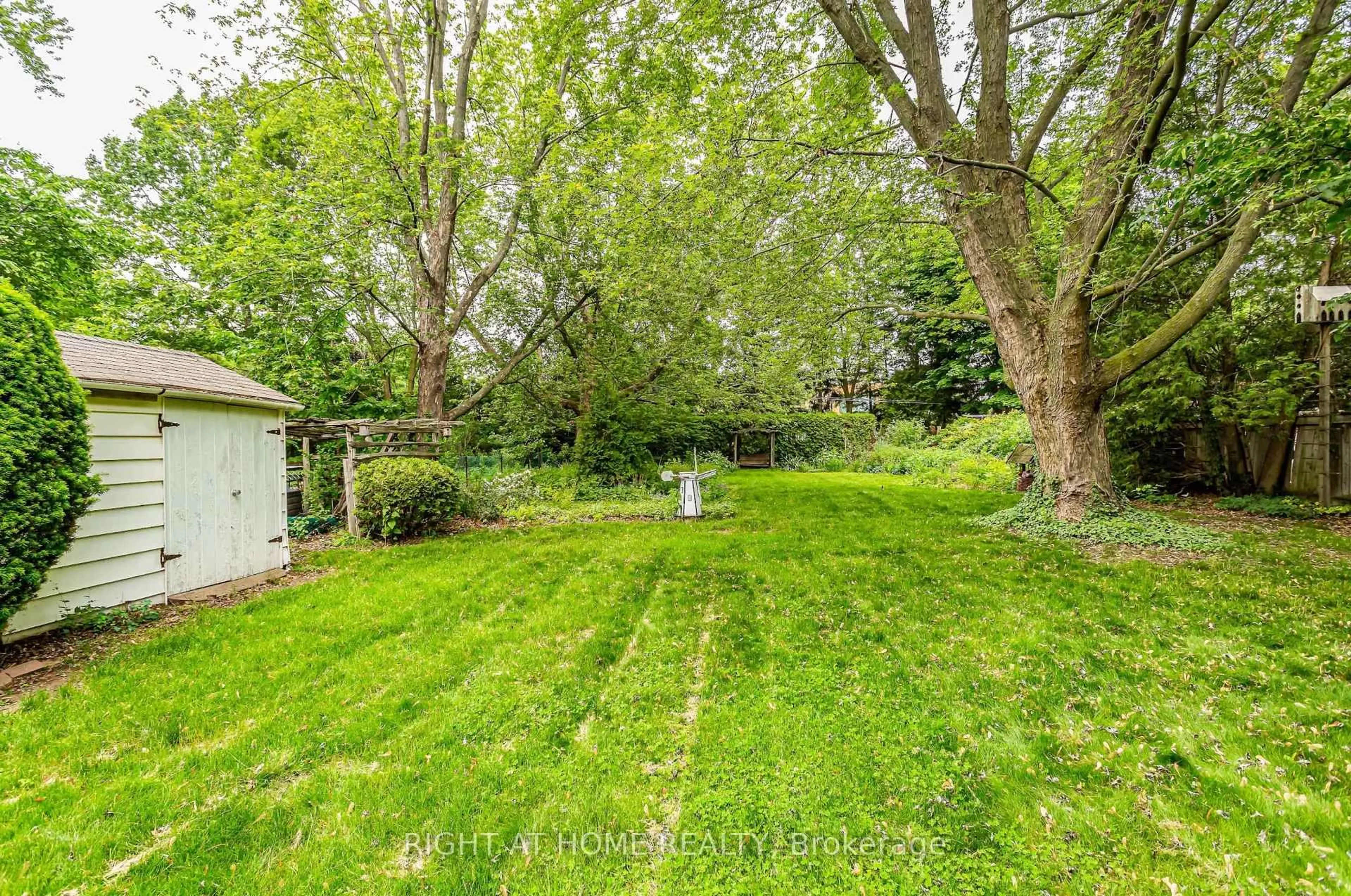 A pic from outside/outdoor area/front of a property/back of a property/a pic from drone, forest/trees view for 411 Maplehurst Ave, Oakville Ontario L6L 4Y3