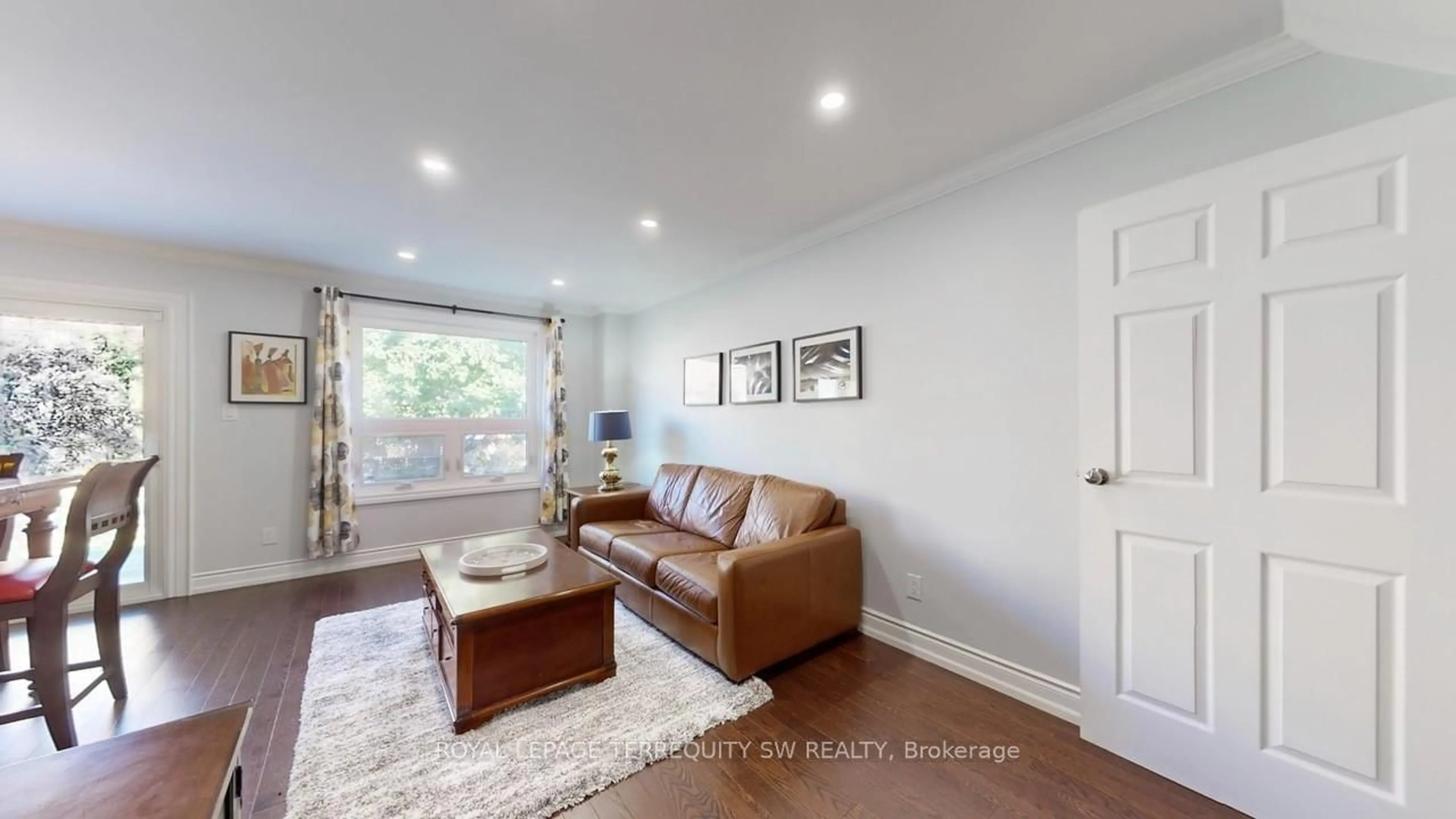 Living room with furniture, wood/laminate floor for 4287 Beacon Lane, Mississauga Ontario L5C 3V8