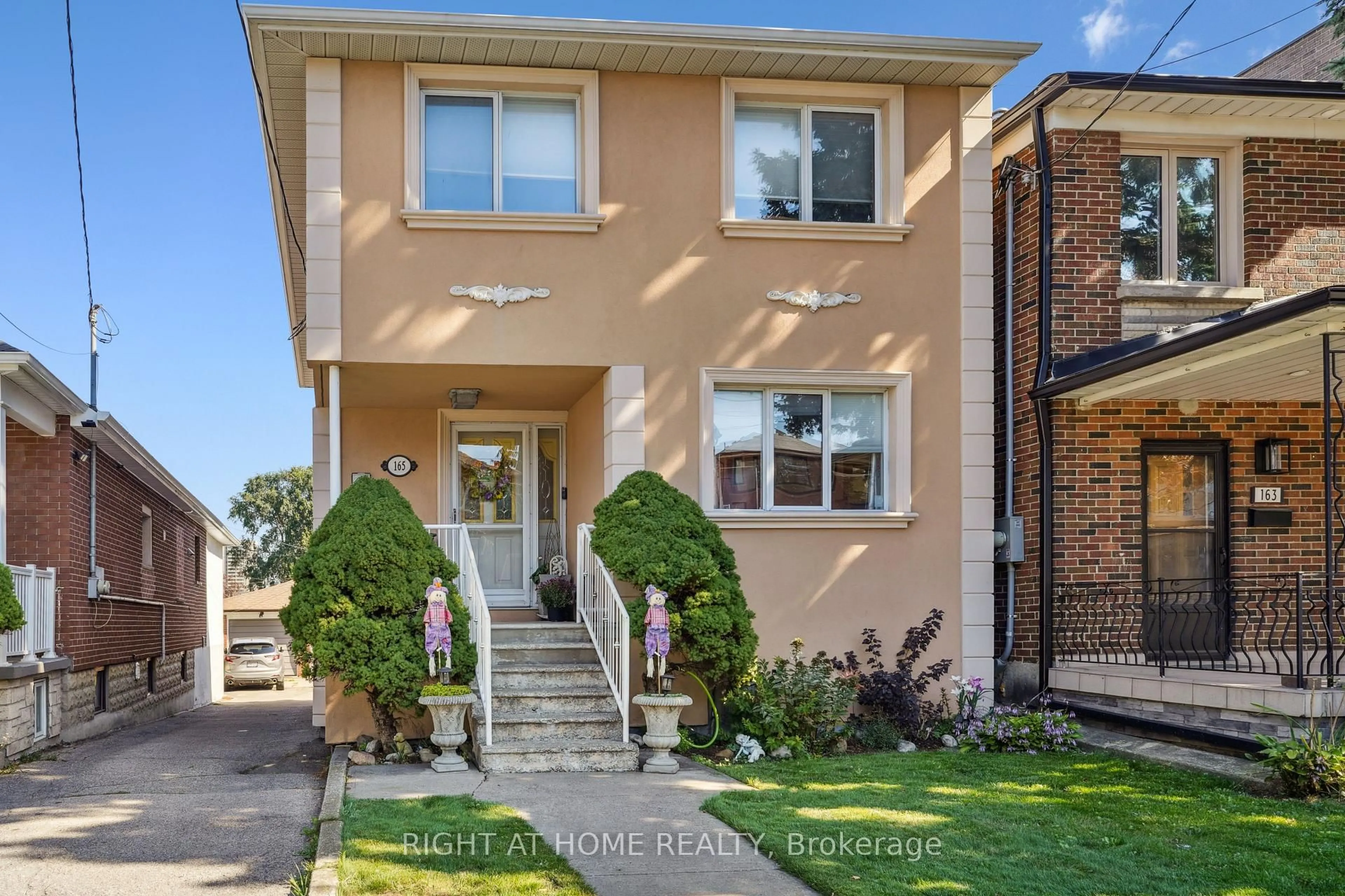 Home with brick exterior material, street for 165 Locksley Ave, Toronto Ontario M6B 3N4
