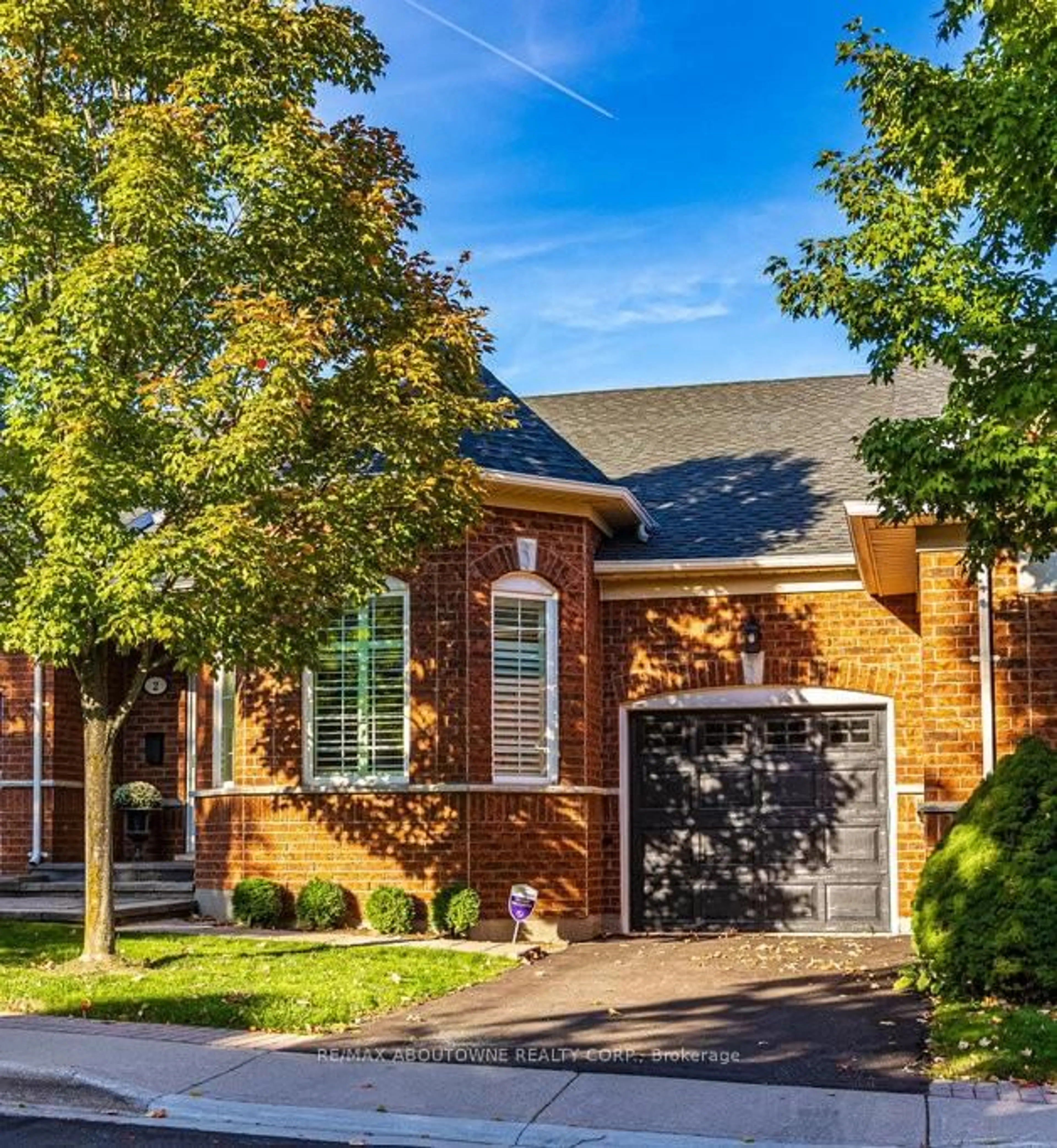 Home with brick exterior material, street for 2590 Carberry Way #2, Oakville Ontario L6M 5G2