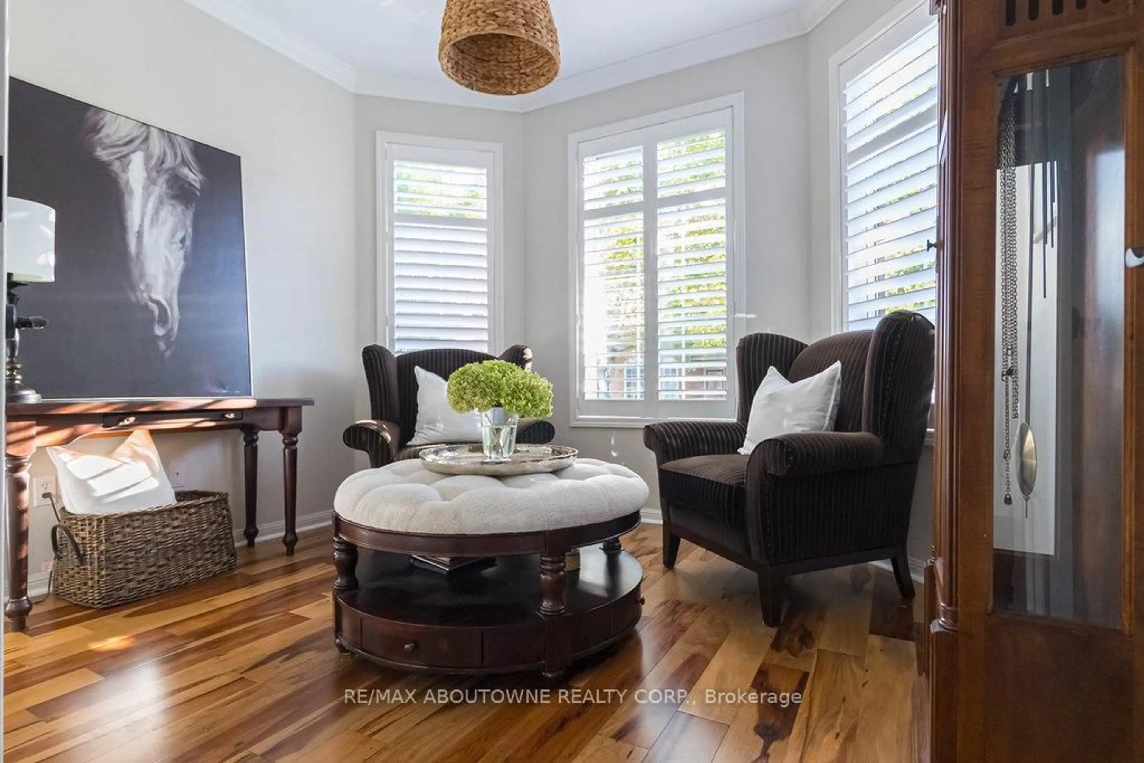 Living room with furniture, wood/laminate floor for 2590 Carberry Way #2, Oakville Ontario L6M 5G2