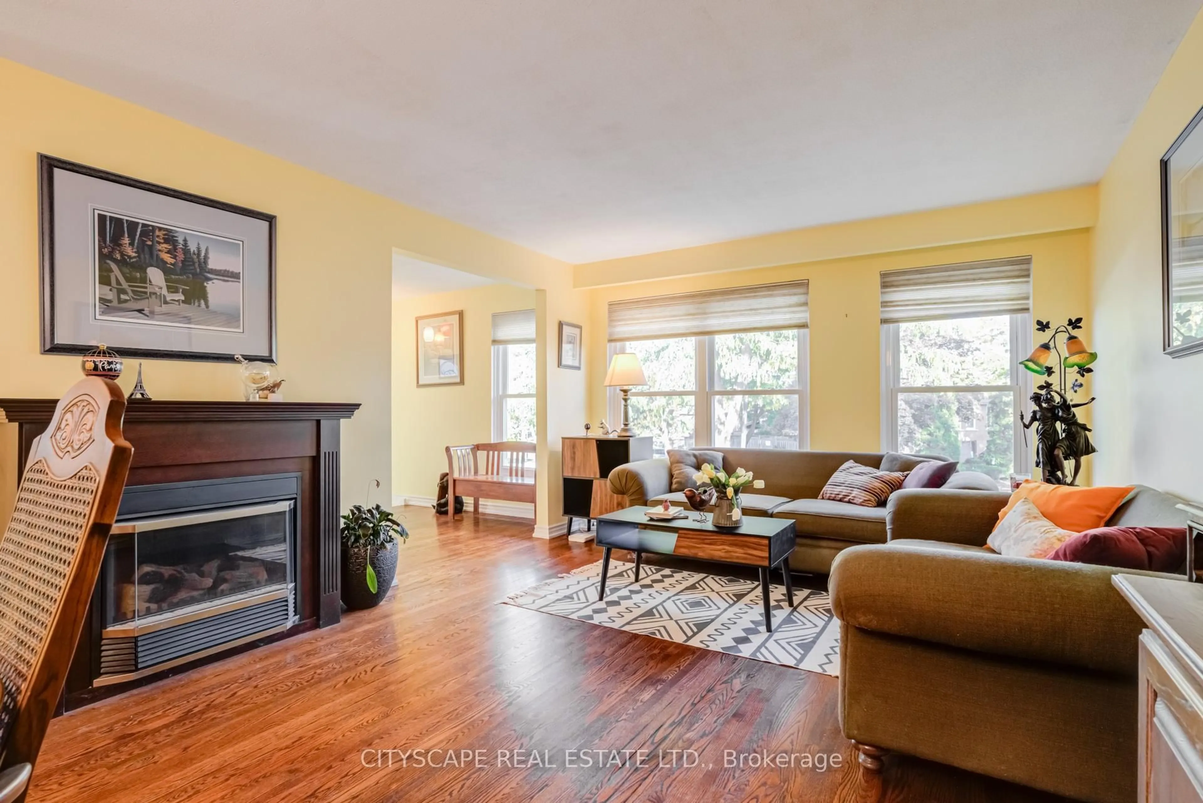 Living room with furniture, wood/laminate floor for 22 Jade Cres, Brampton Ontario L6S 3H1